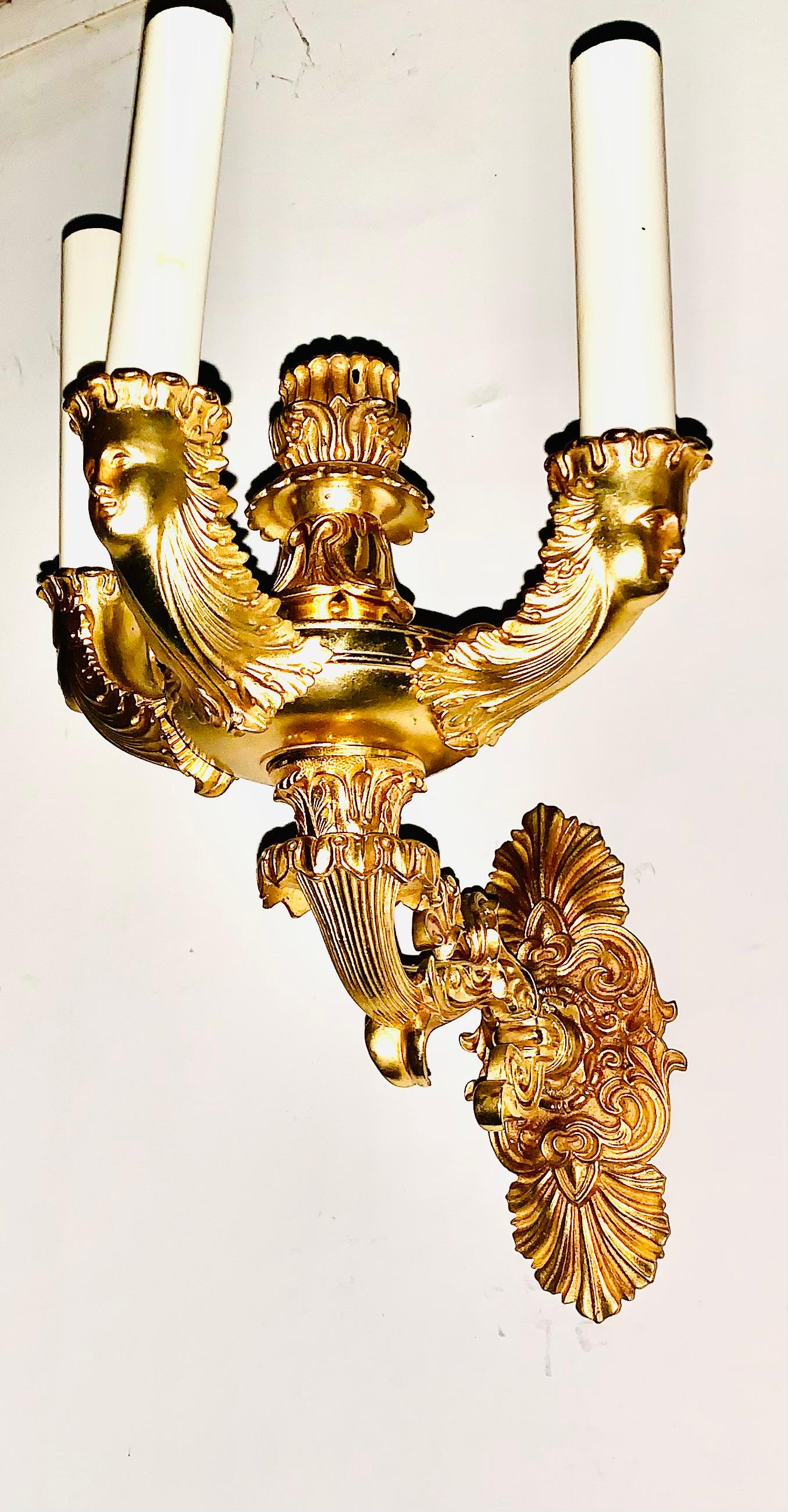 Superb pair of antique French Empire period gilt bronze figural three light sconces
Circa 1830
Striking figural sconces originally created for use with oil, now electified. This beautifully balanced style is perfect for elevating and adding interest