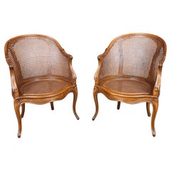Fine Pair French Louis XV Style Cane Back Bergère Chairs in Walnut Circa 1940s