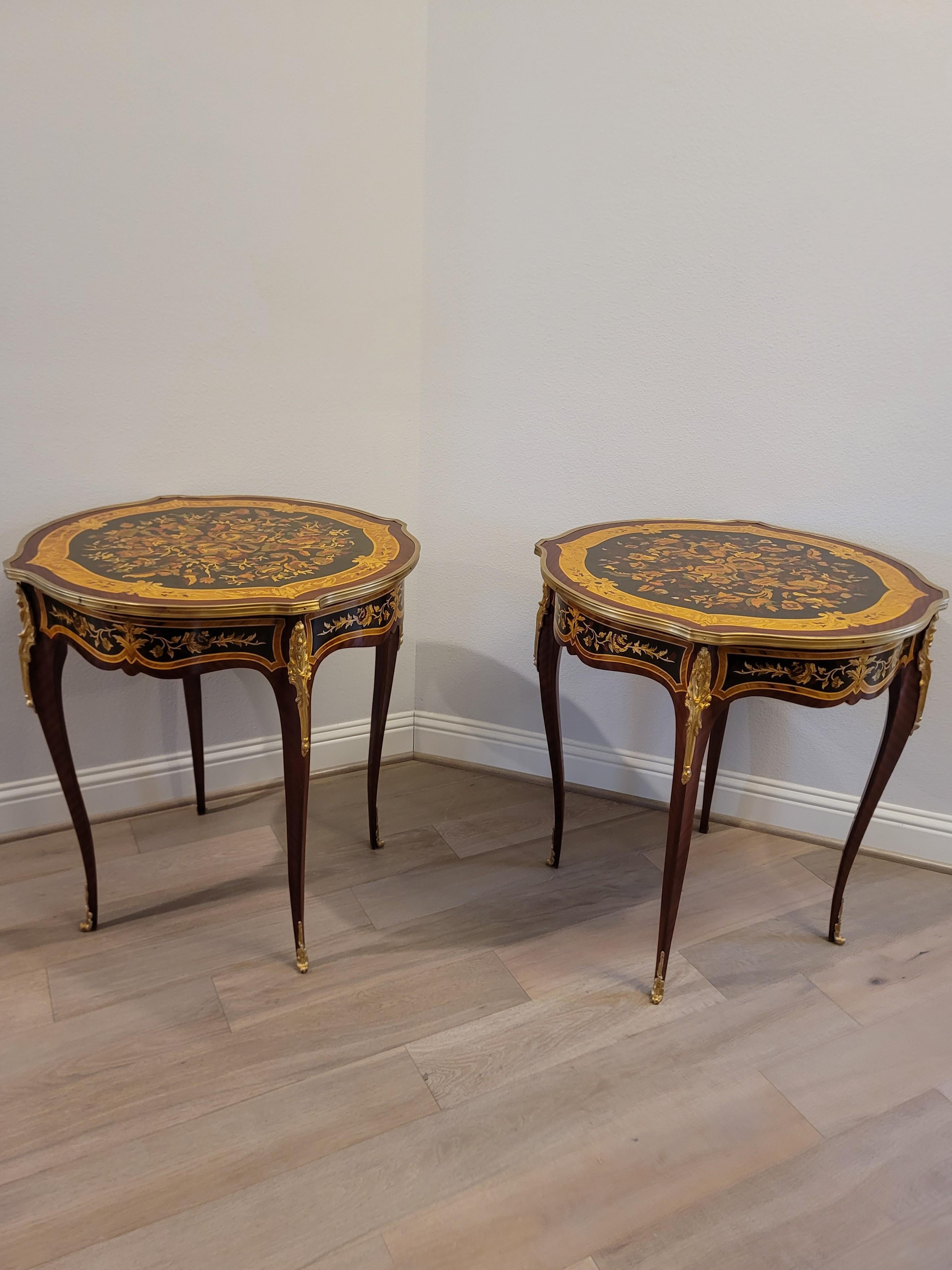 A fine pair of French Louis XV style gilt bronze mounted marquetry inlaid mahogany side tables.

Exquisitely hand-crafted in France, 20th century, fine quality, exceptionally executed in luxurious Louis XV style with Napoleon III Second Empire