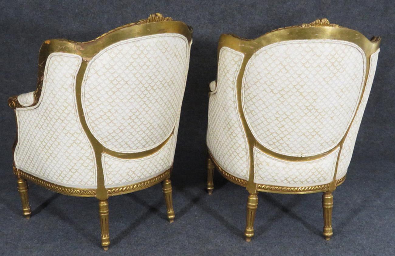 Early 20th Century Fine Pair of Gilded French Louis XVI Bergère Lounge Chairs, circa 1920s