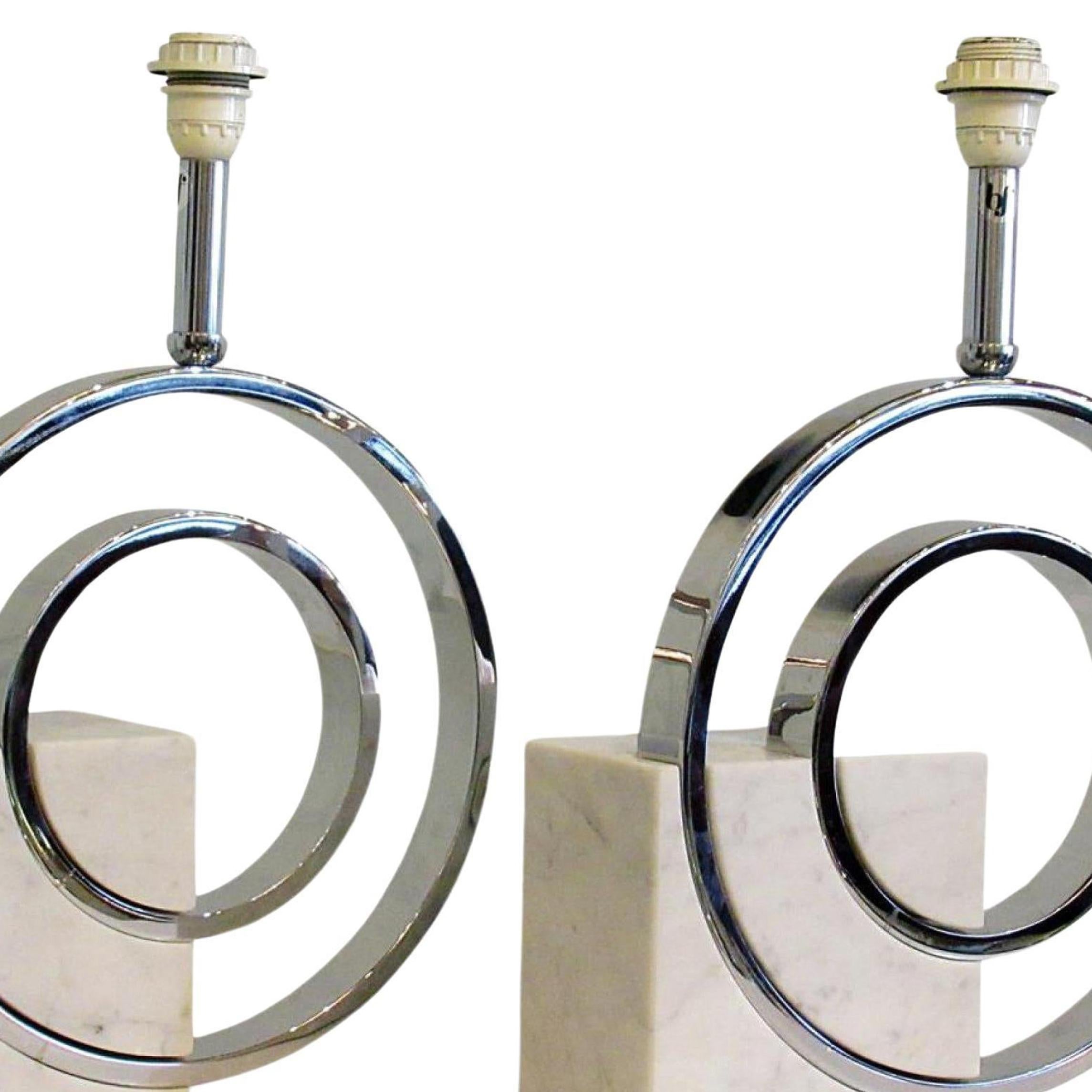 Pair of Italian mid century table lamps featuring a chromed metal double circle and stem design imbedded in a marble block base (PRICED AS Pair) (Giovanni Banci for Banci Firenze; Stamped: BF)

Does not ship with shades