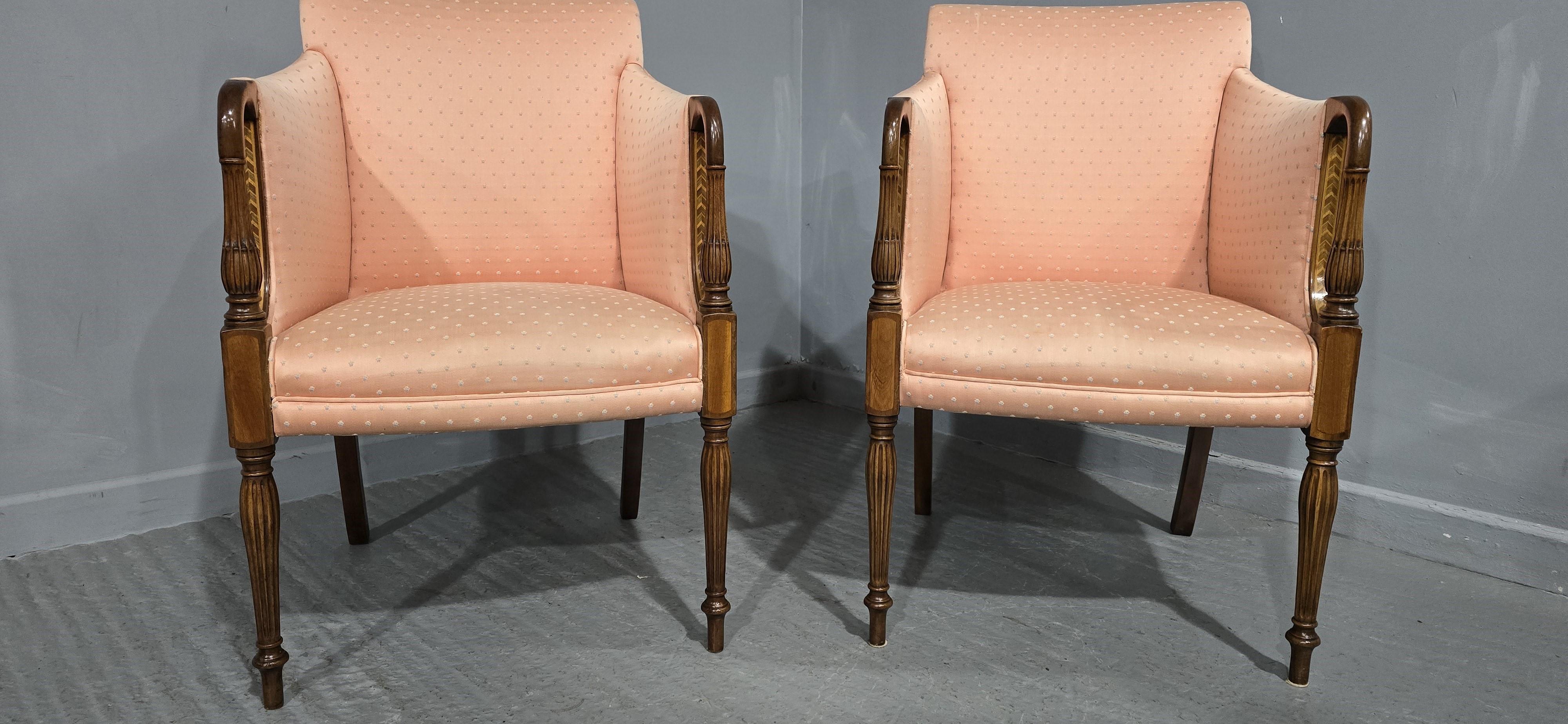 A very nice pair of mahogany tub, elbow or library chairs, with reeded fronts and diamond inlay, in overall great condition.

36