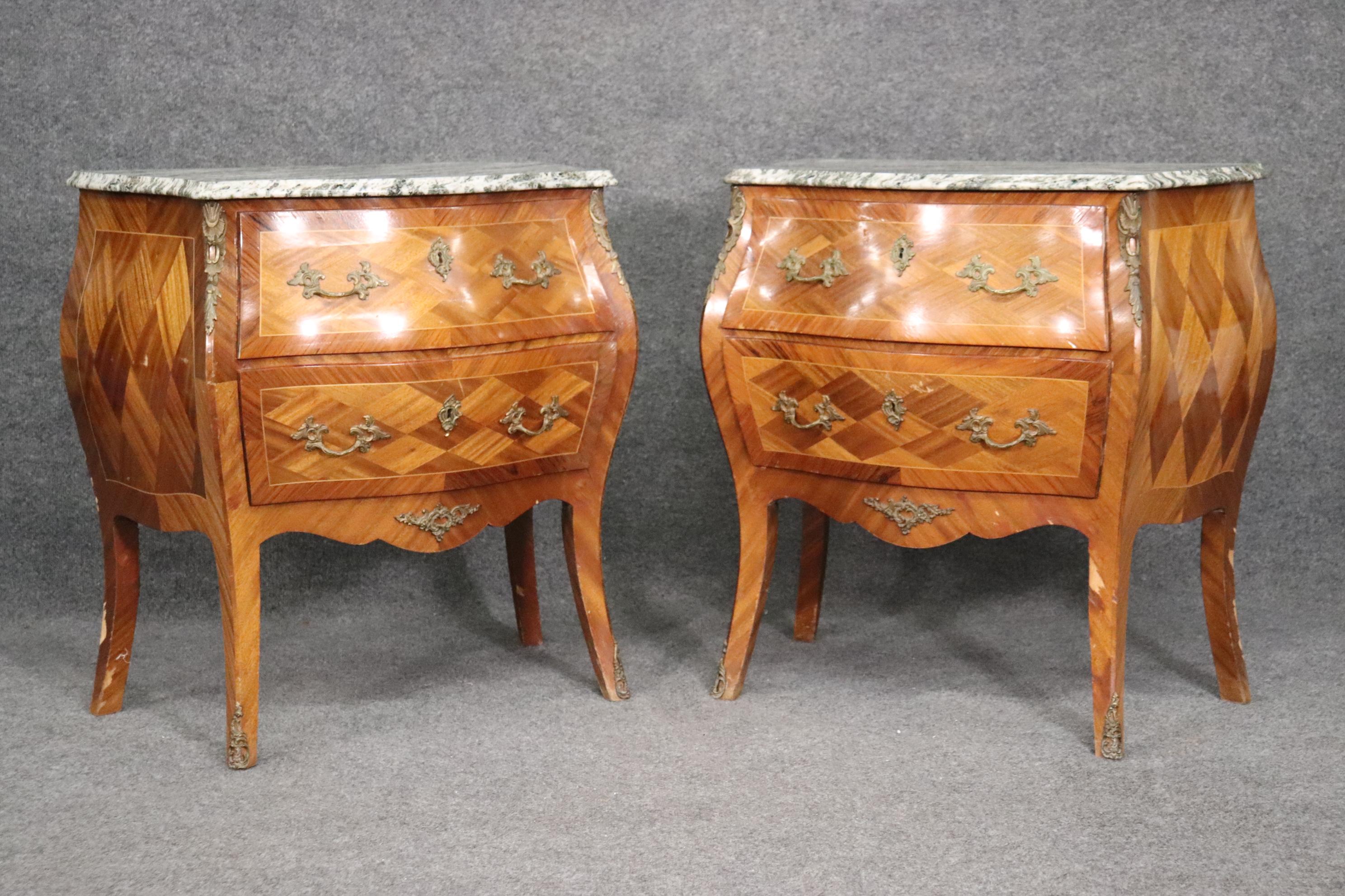 These are beautiful! Look at the kingwood marquetry cases and the gorgeous marble top. The stands are in very good condition and measures 28 wide x 18 deep x 30 tall. Dates to the 1940s era.