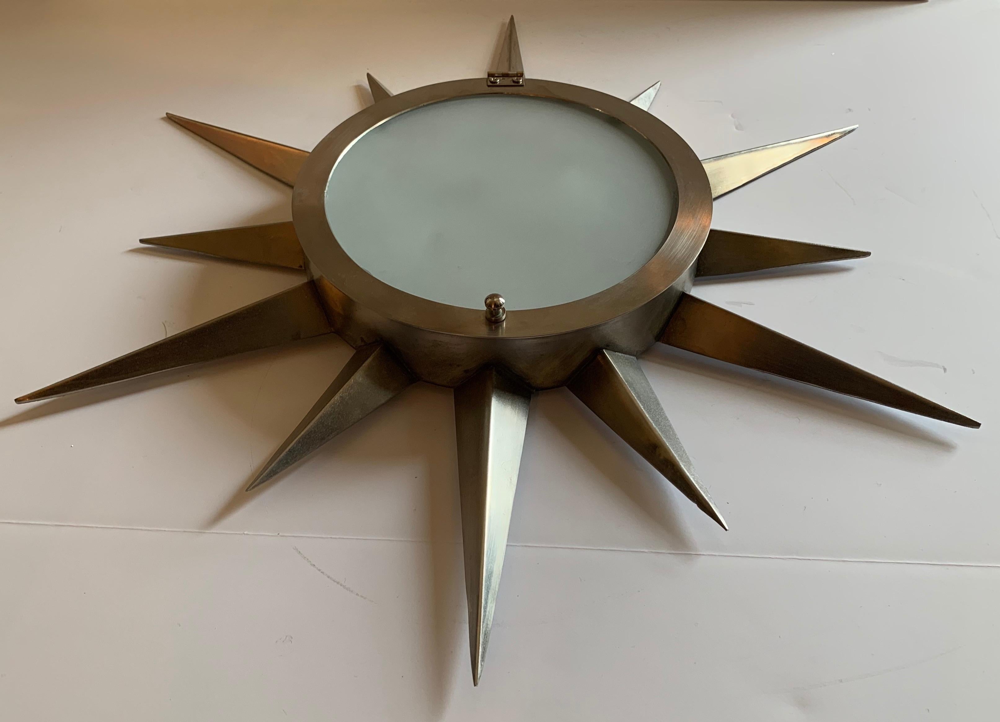A fine Mid-Century Modern brush brass star form frosted glass flush mount ceiling light fixture with 2 candelabra sockets

