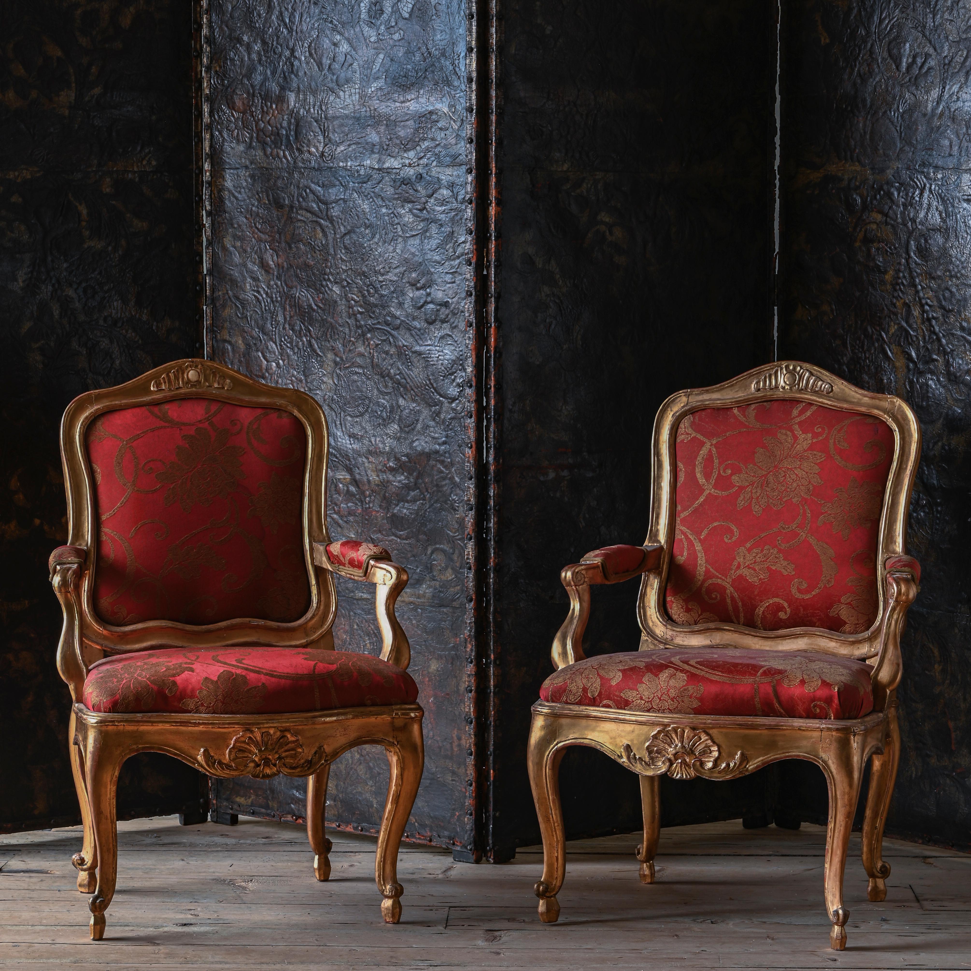 Fine pair of 18th century Rococo giltwood armchairs. Stockholm, Sweden, circa 1770. Similar exceptional chairs can be found at the royal palace in Stockholm.