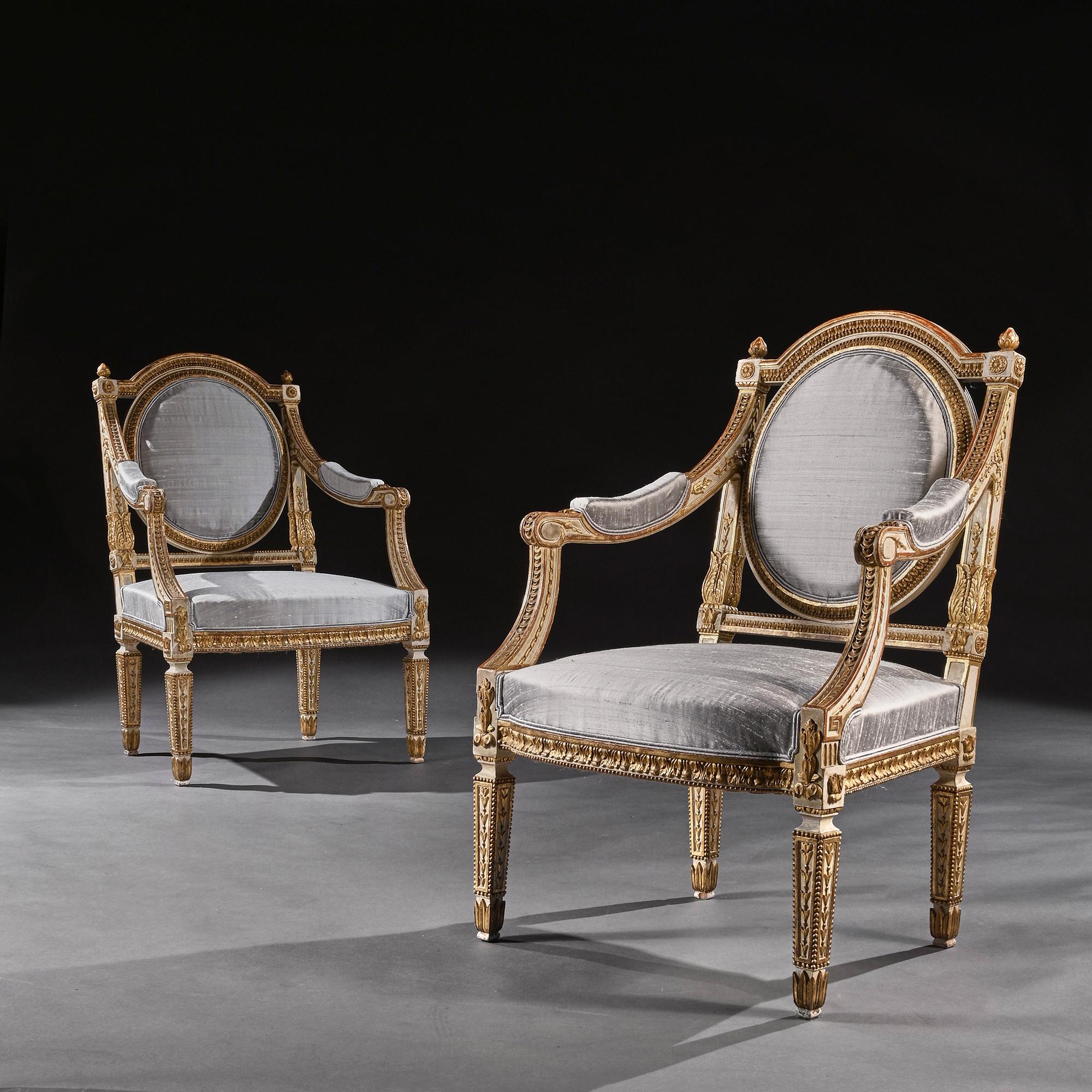 Extremely fine pair of decorative 19th Century Italian painted and parcel gilt armchairs of neo-classical design.

Italian Late 19th C - Circa 1880.

Oozing style these very attractive parcel gilt armchairs have husk and foliate-carved