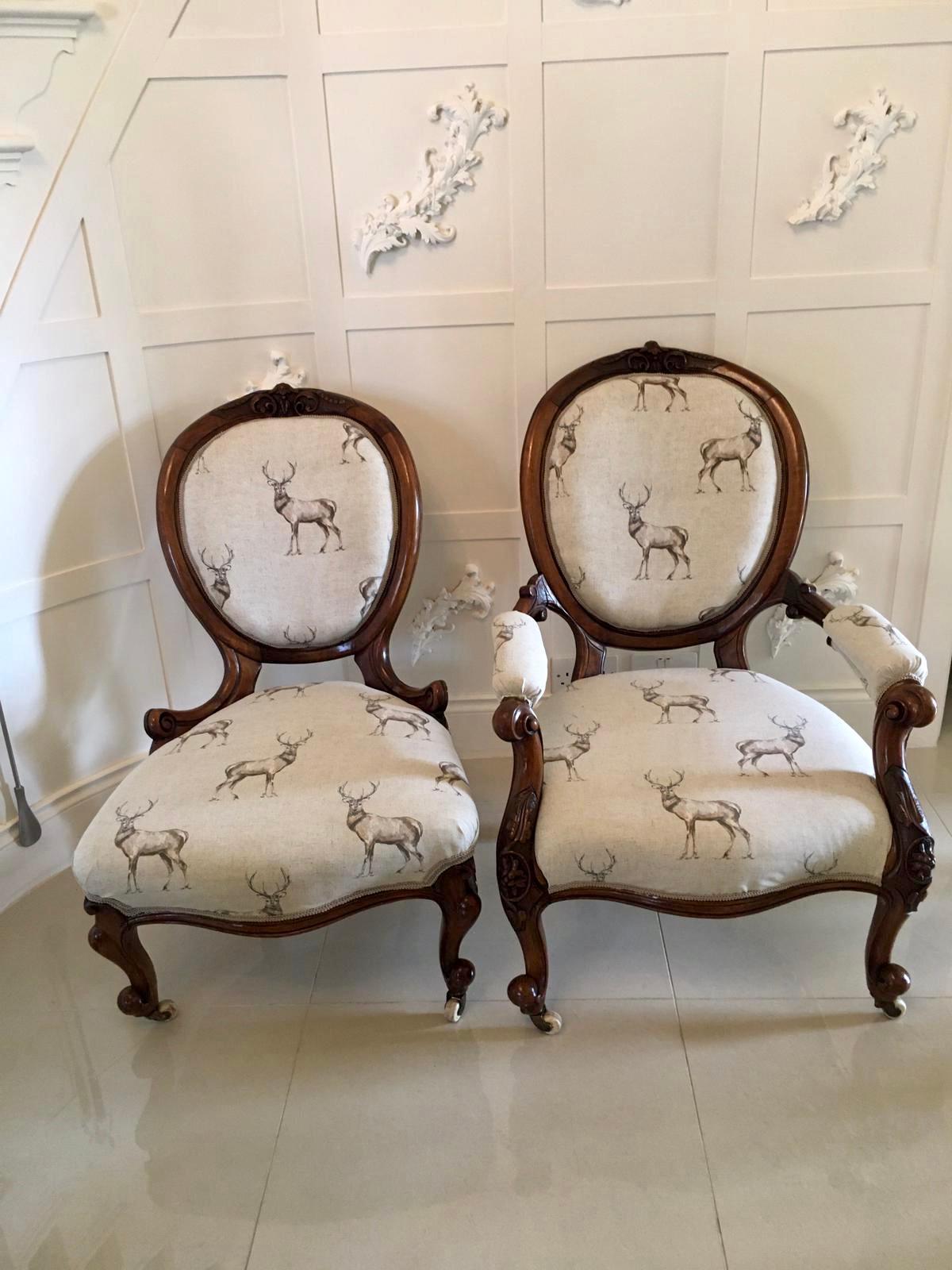 A fine pair of 19th century antique Victorian carved walnut chairs having a marvelous walnut shaped carved backs and tops with shaped supports. One boasts lovely shaped carved open arms, both standing on elegantly shaped carved cabriole legs to the