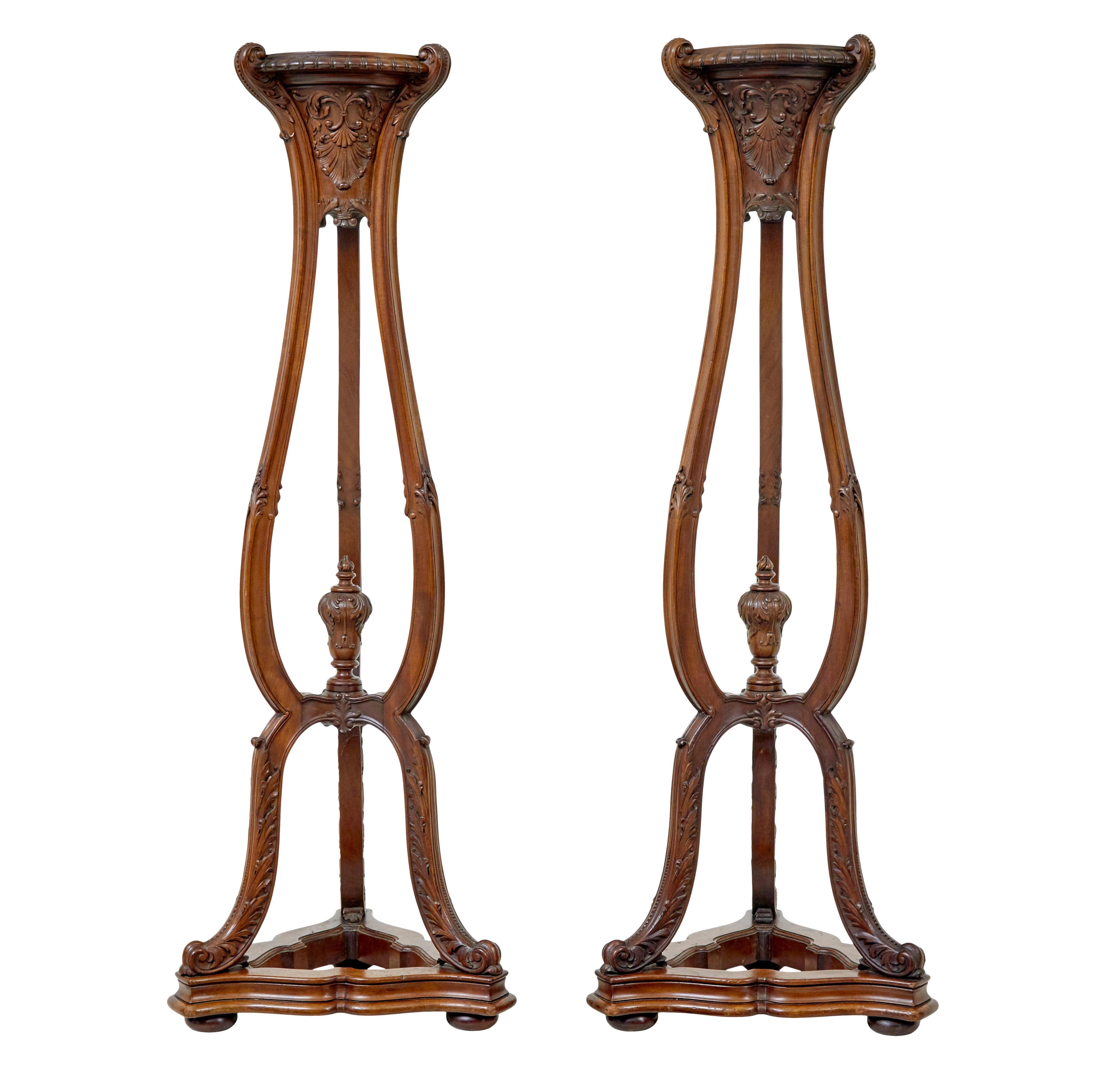 Fine pair of carved mahogany torcheres by Morison & Co circa 1890.

We are pleased to present this fine pair of torchere stands made by Morison & co of Edinburgh.

Morison & co, established in 1808 were amoung the finest furniture makers in Scotland