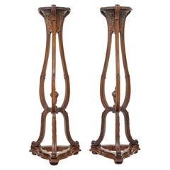 Fine pair of 19th century carved mahogany torcheres by Morison & Co