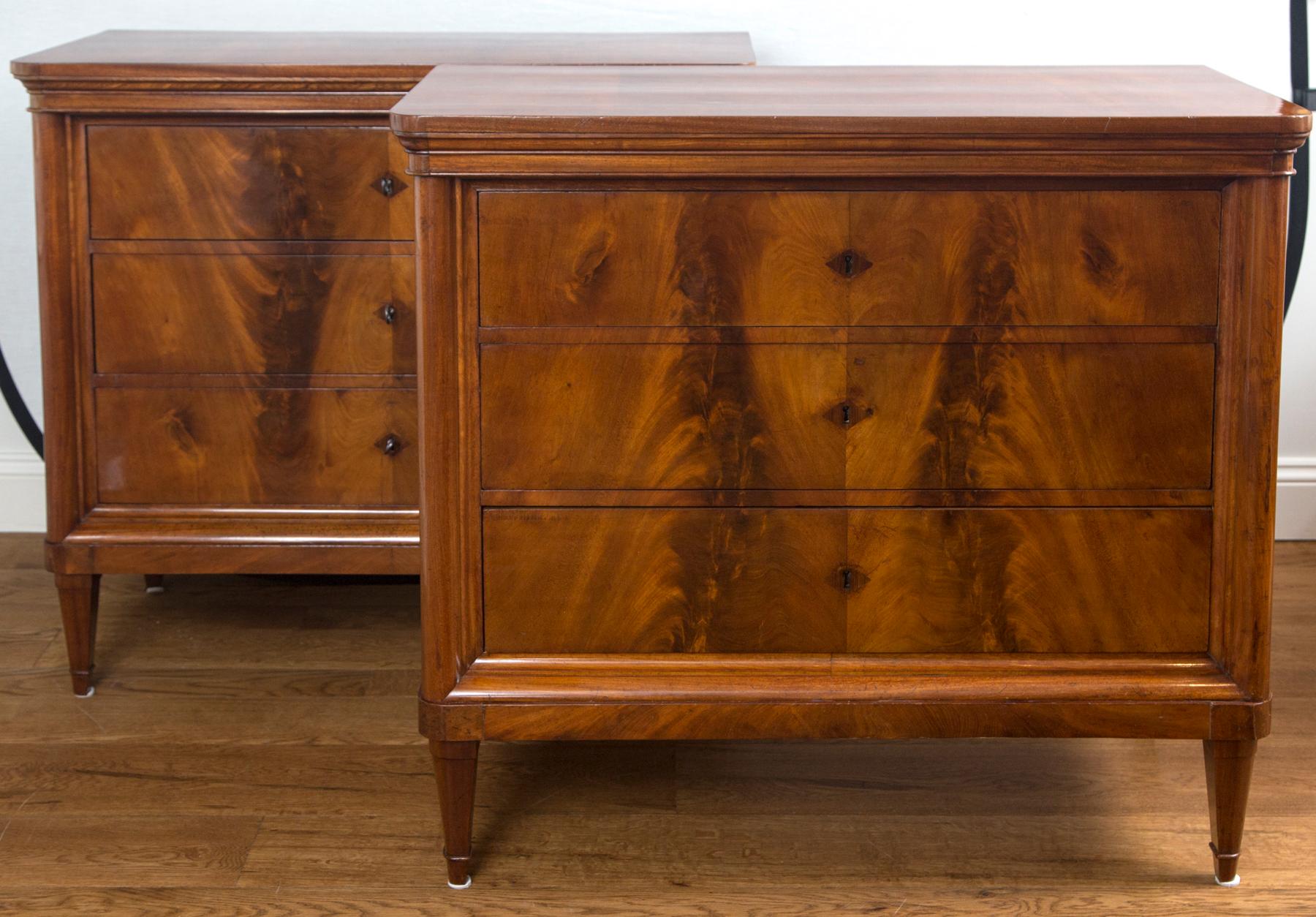 A very fine pair continental chests each with a beveled and rounded front molding showcasing three drawers with diamond shaped inlaid keyholes, finishing on straight tapered legs, all original, secondary wood is oak, note veneer interior drawers