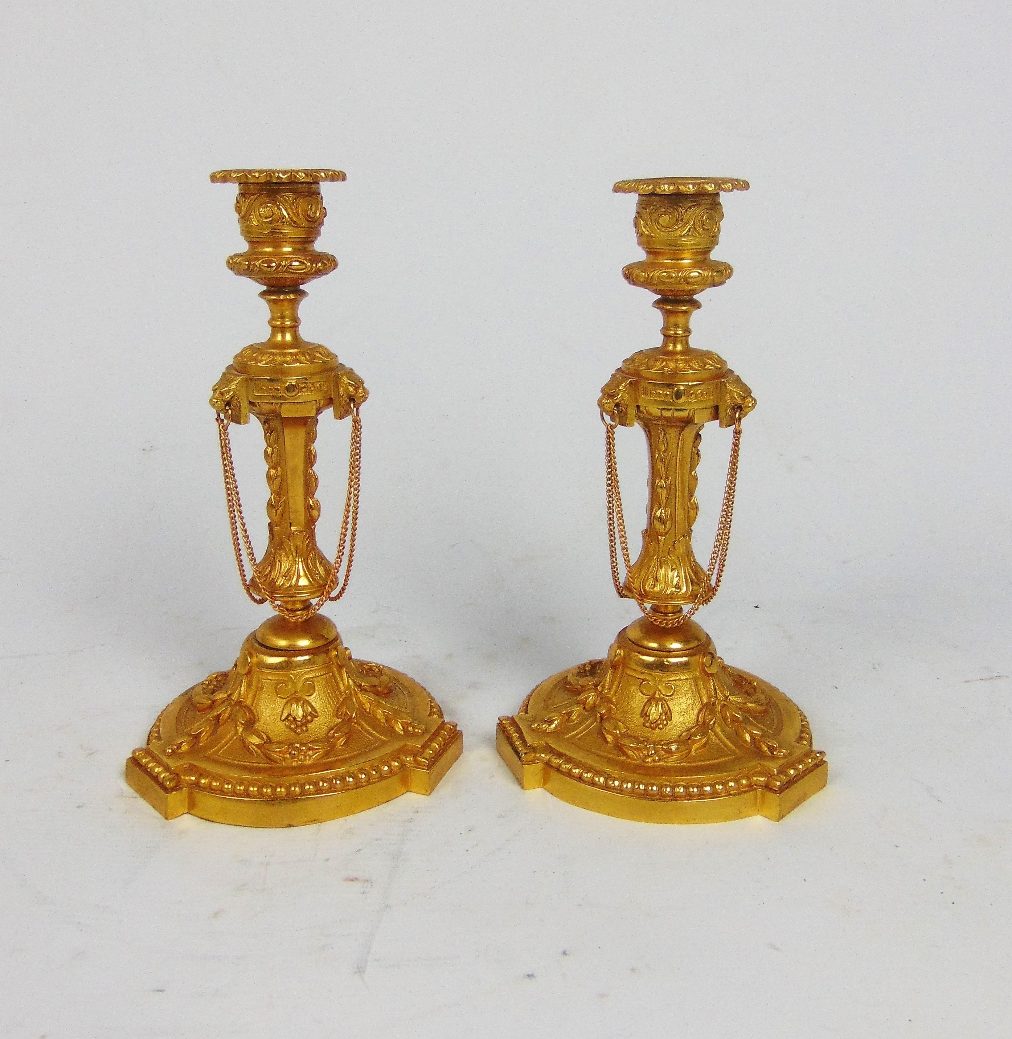 A superb quality A superb quality pair of 19th century Gilt Bronze candlesticks with lions heads over floral and swag decorated bases .
Circa 1860
23.5cm tall 
13cm wide across the base
£1180 over floral and swag decorated bases .
Circa