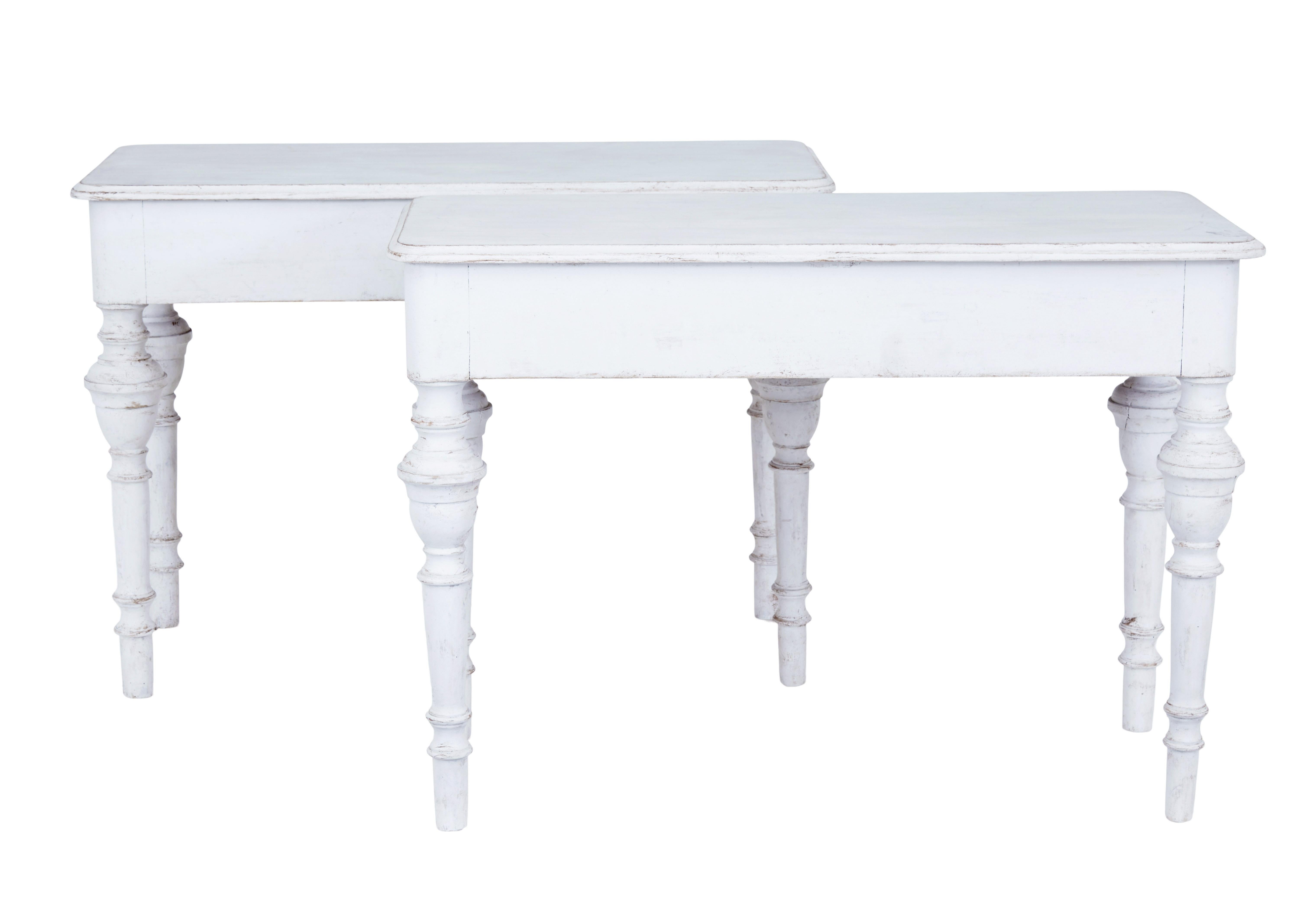 Fine pair of 19th century Swedish painted pine console tables circa 1870.

Simple but elegantly designed pair of console tables with a desirable deep frieze. Rectangular top surface with a bull nosed edge. Each supported by 4 turned