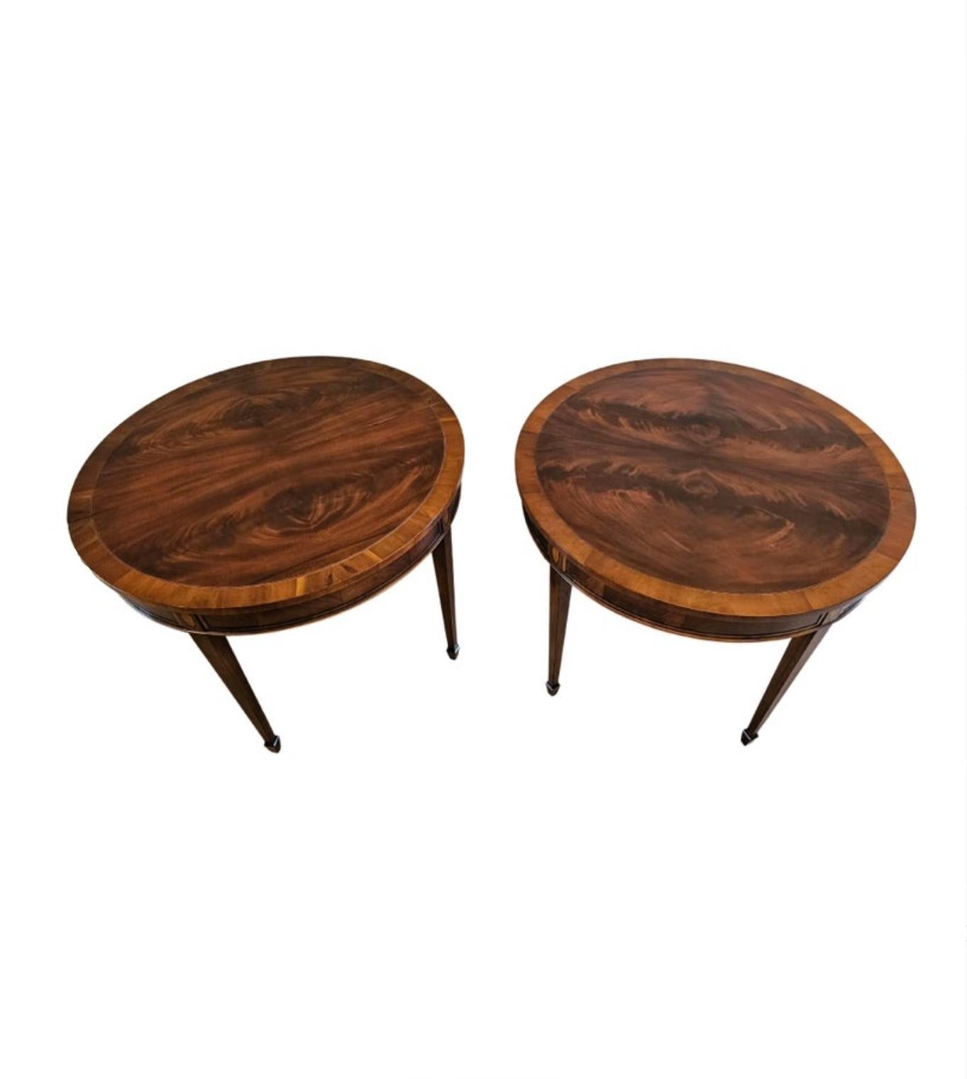 A fine pair of vintage richly figured flame mahogany demilune consoles / round games tables by high-quality American furniture maker Hekman Furniture, since 1922, Grand Rapids, Michigan, United States. 

Exquisitely hand-crafted, dating to the