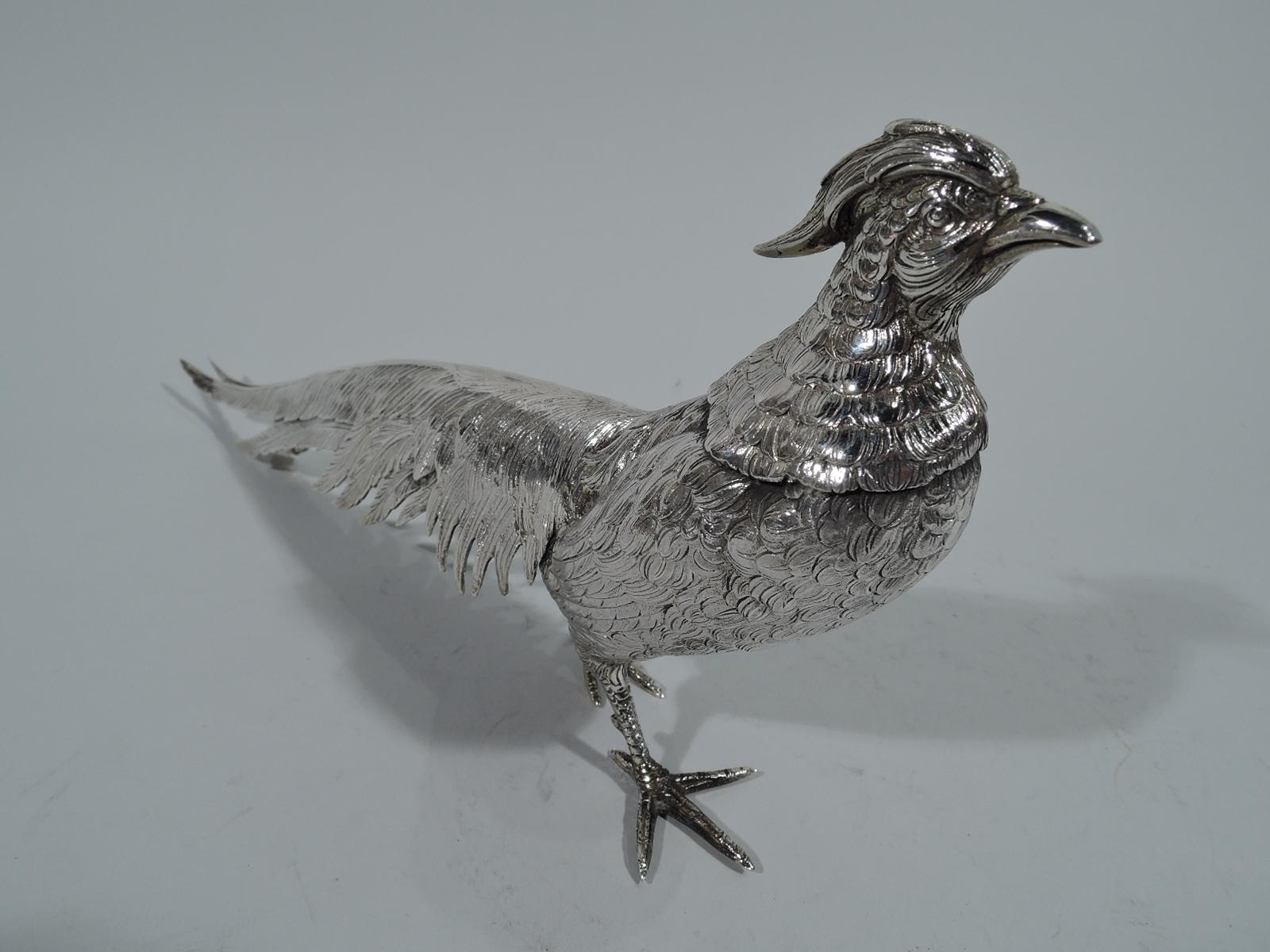 Fine pair of German 830 silver pheasants, circa 1910. A male-female couple with downy bodies, long tails, upright busts with alert heads, and scaly talons. The male has an impressive crown and neck ruff. Hallmarked. 

Dimensions: Male: H 6 x W 13