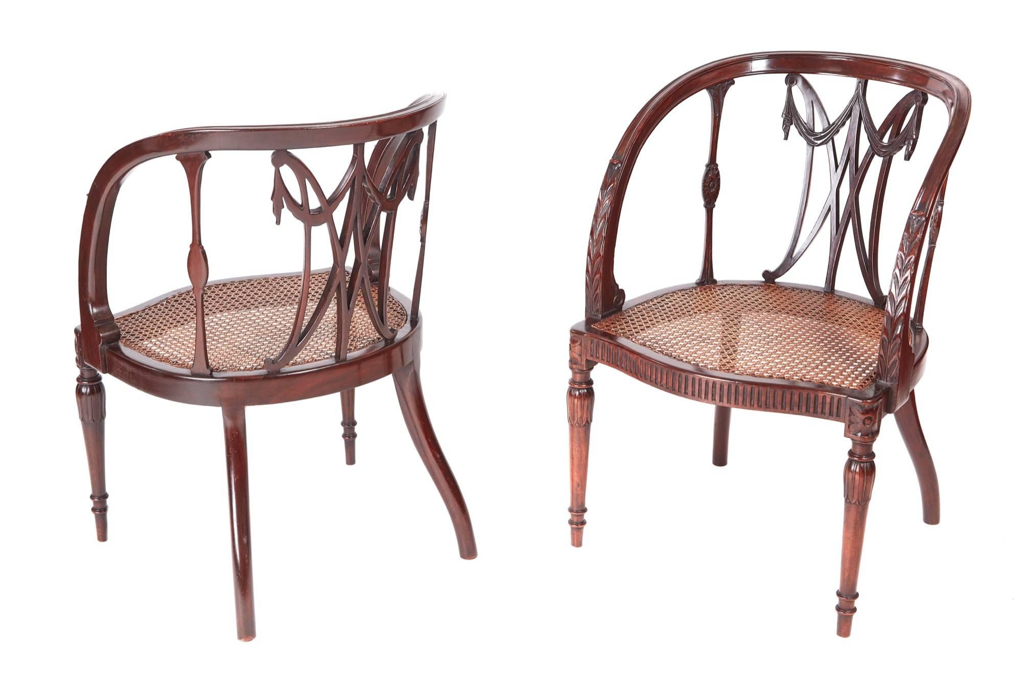 Fine pair of antique mahogany hepplewhite style library chairs, with attractive carved backs, lovely carved shaped arms, bergere seats, reeded serpentine front rail ,standing on fine carved turned legs to the front outswept back legs
Lovely color