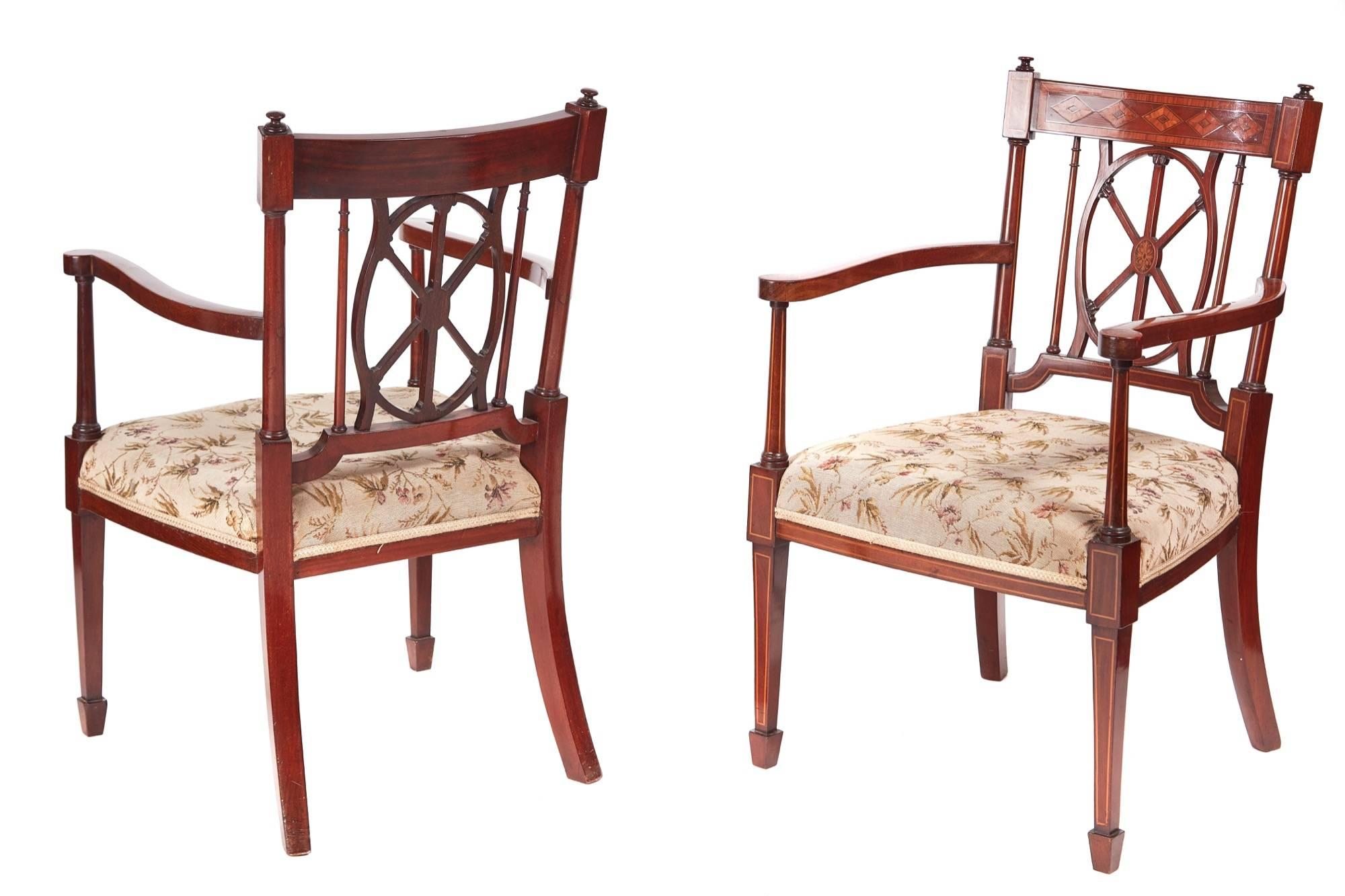Fine pair of antique mahogany inlaid arm/desk chairs, with fine inlaid satinwood tops, lovely inlaid centre splat, shaped inlaid arms, standing on inlaid square tapering front legs terminating in spade feet outswept back legs
Lovely color and