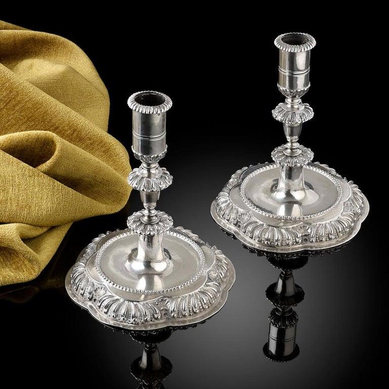 A fine pair of Baroque silver candlesticks; rare town marks for Cologne, Germany from the end of the 17th century; the maker, Bernardus Schorass; each stick is cast in two pieces which screw together; they measure 15.5cm in height, 13.5cm in