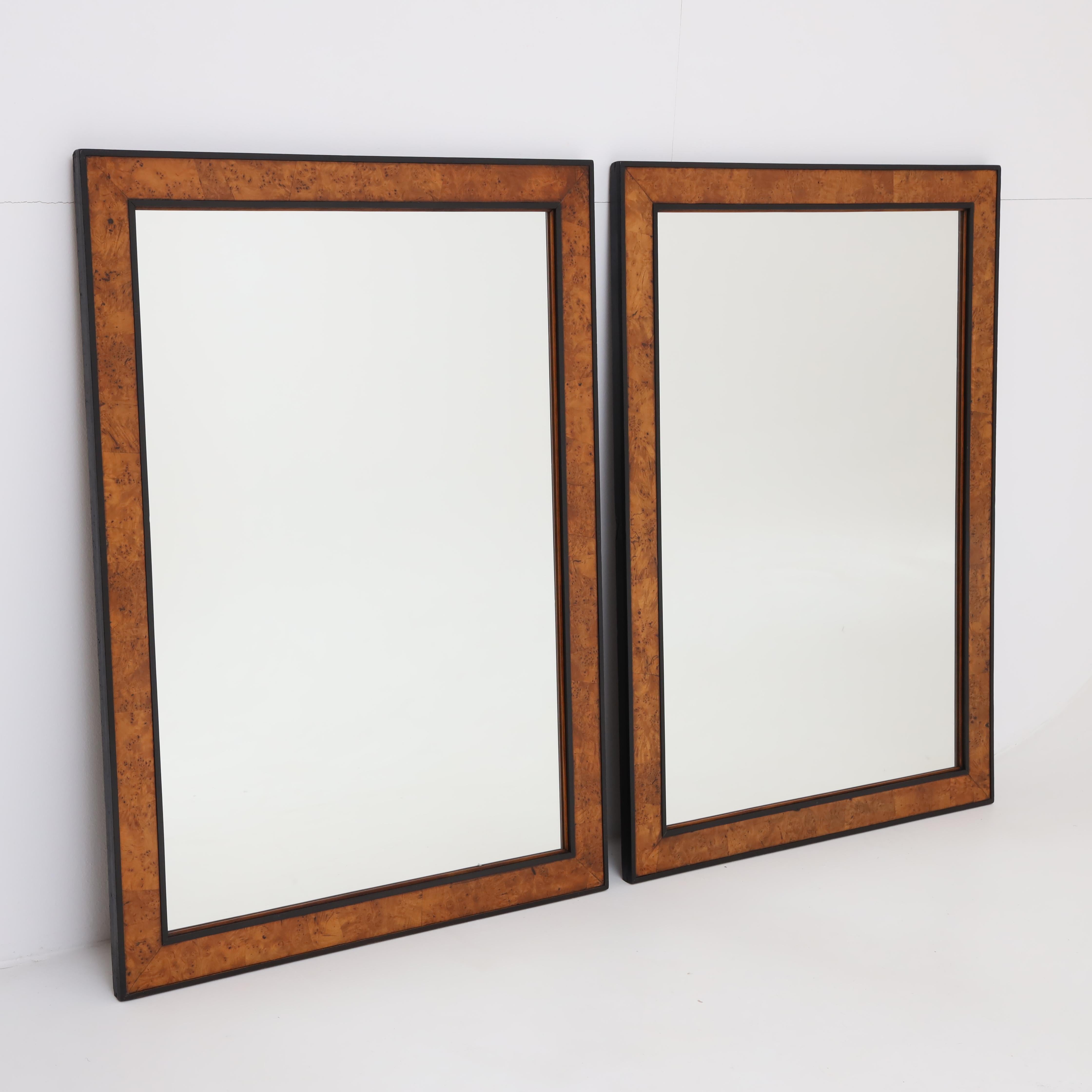 A pair of Biedermeier mirrors. 
Walnut with ebonized sides..