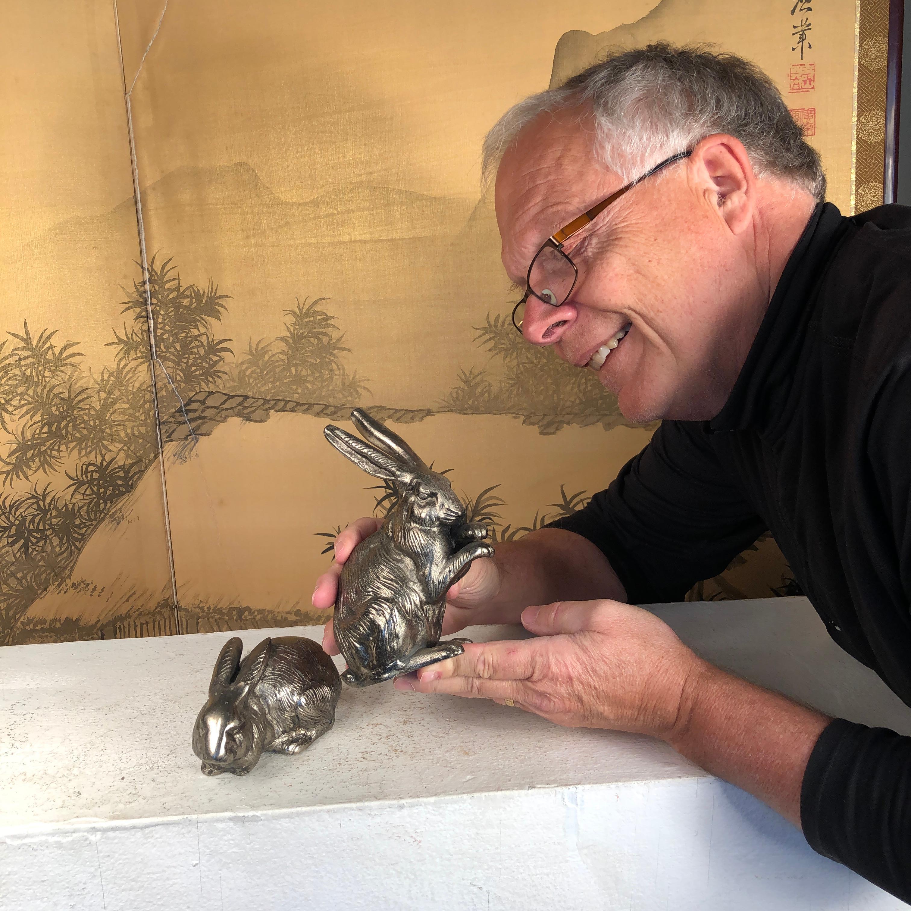 Finest quality antique hand cast rabbits from Japan!

This is a fine pair (2) of large scale solid hand cast effigy pair of playful rabbits usagi in attractive silver bronze. These were sourced from a Japanese southern collection this past