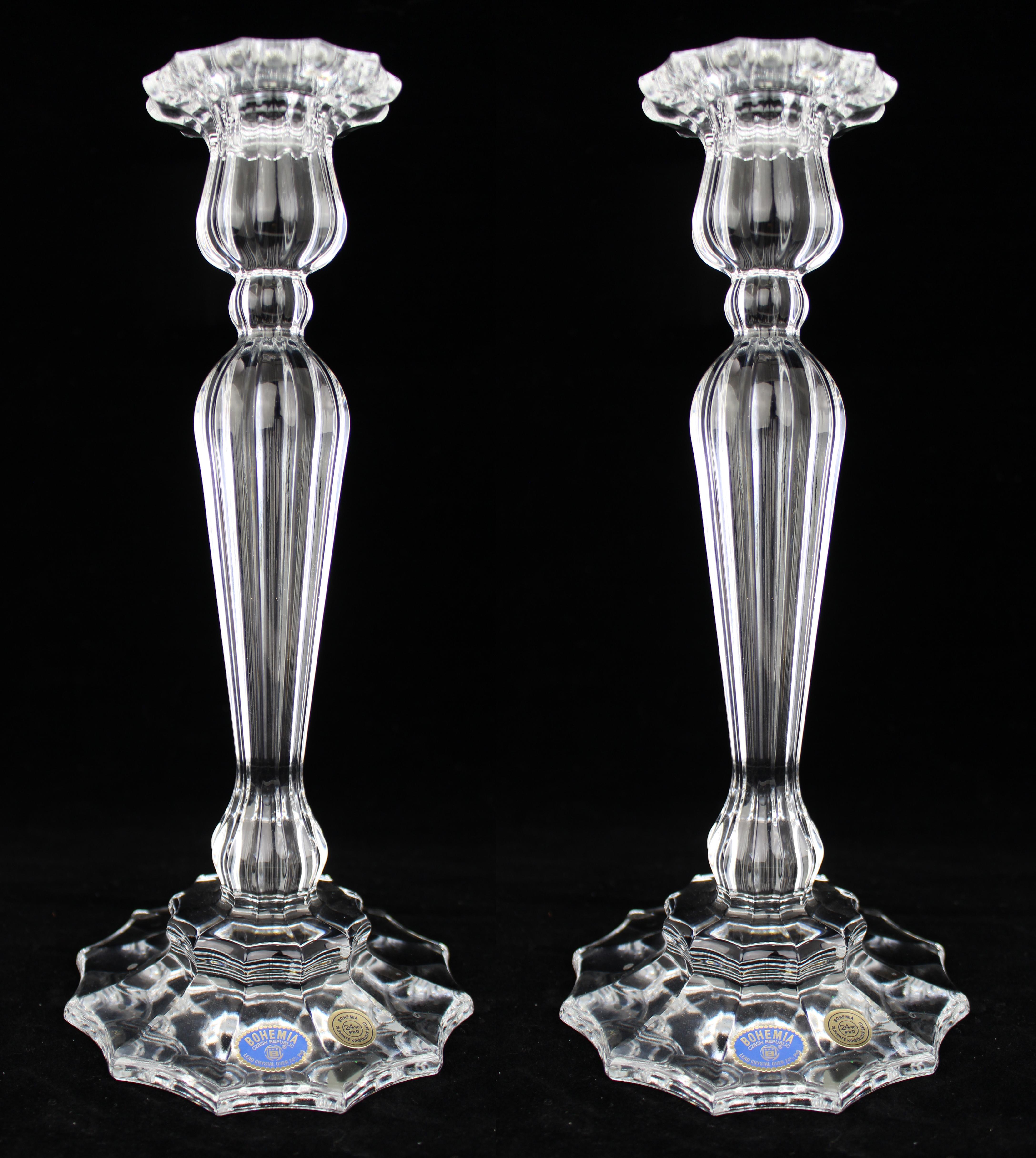 Fine Pair of Bohemia Lead Crystal Candlesticks


A finely made pair of tall Bohemia lead crystal candlesticks, each displaying crisp vertical fluting and a shaped drip-pan above a well-defined multi-stepped base. The crystal is clear and of good