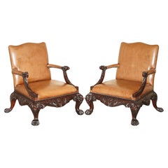 FiNE PAIR OF BROWN LEATHER CARVED GAINSBOROUGH ARMCHAIRS GILES GRENDEY 1693-1780