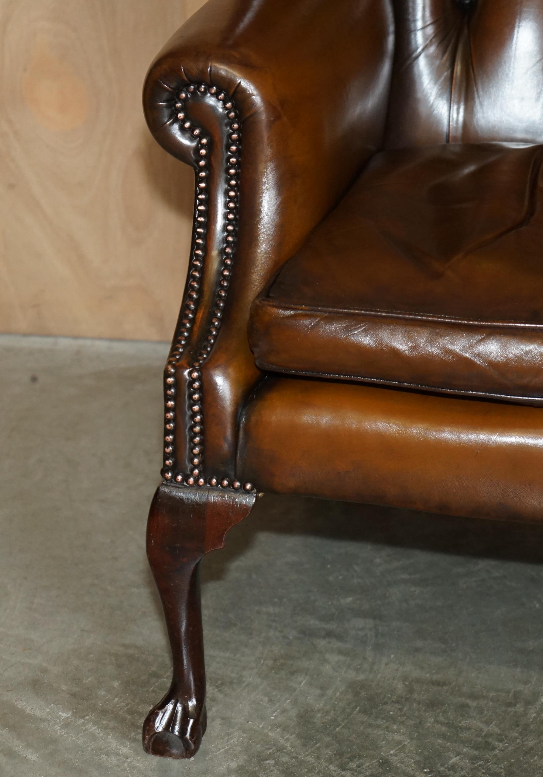 Leather FINE PAIR OF CHESTERFIELD CHESTNUT BROWN LEATHER WINGBACK ARMCHAIRS & FOOTSTOOLs For Sale