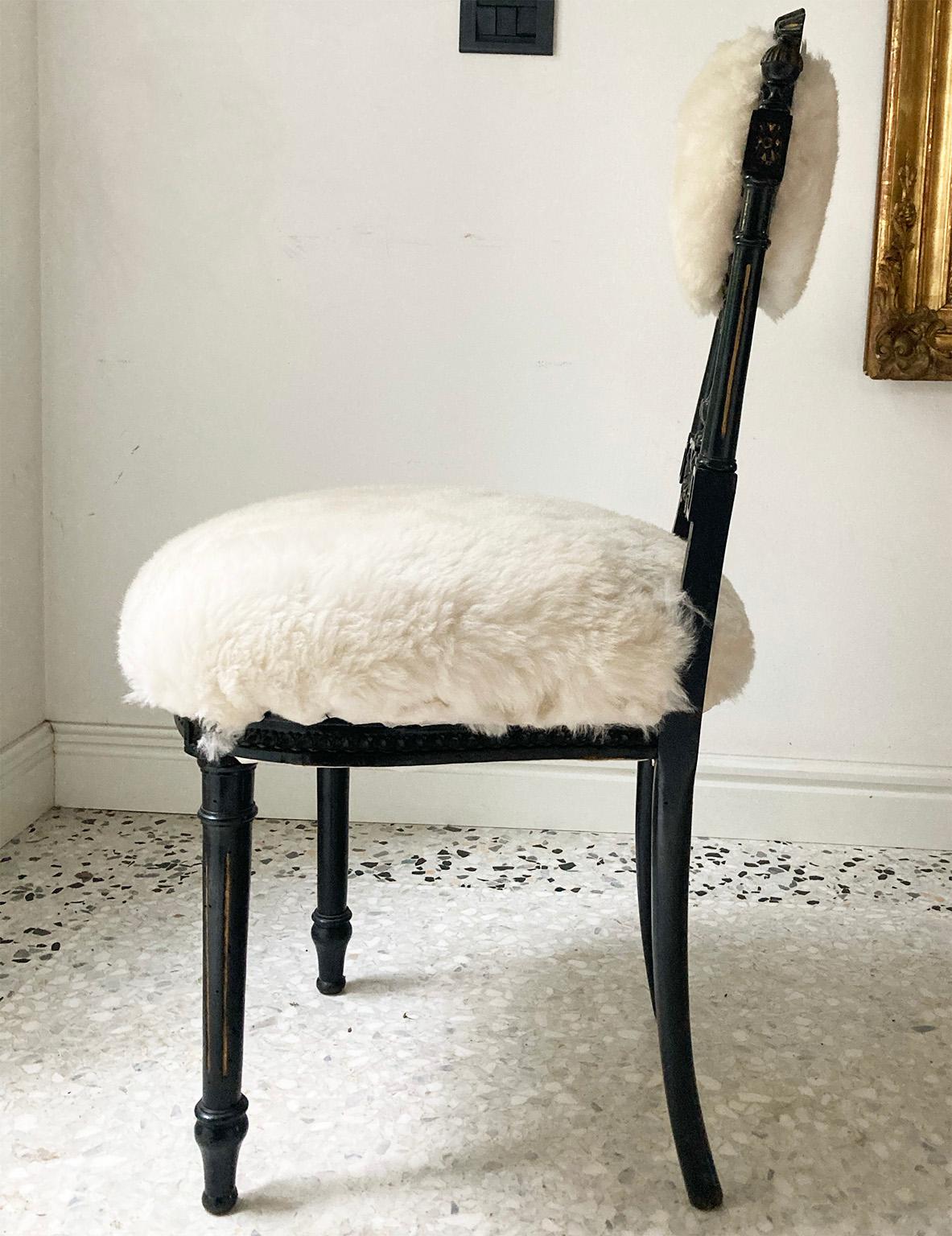 Pair of decorative Sicilian chairs provenance from Private Collection in Palermo , 
Covered with white soft sheep fur 
 The thick white hair in contrast with the thin worked wood creates a particular proportion.