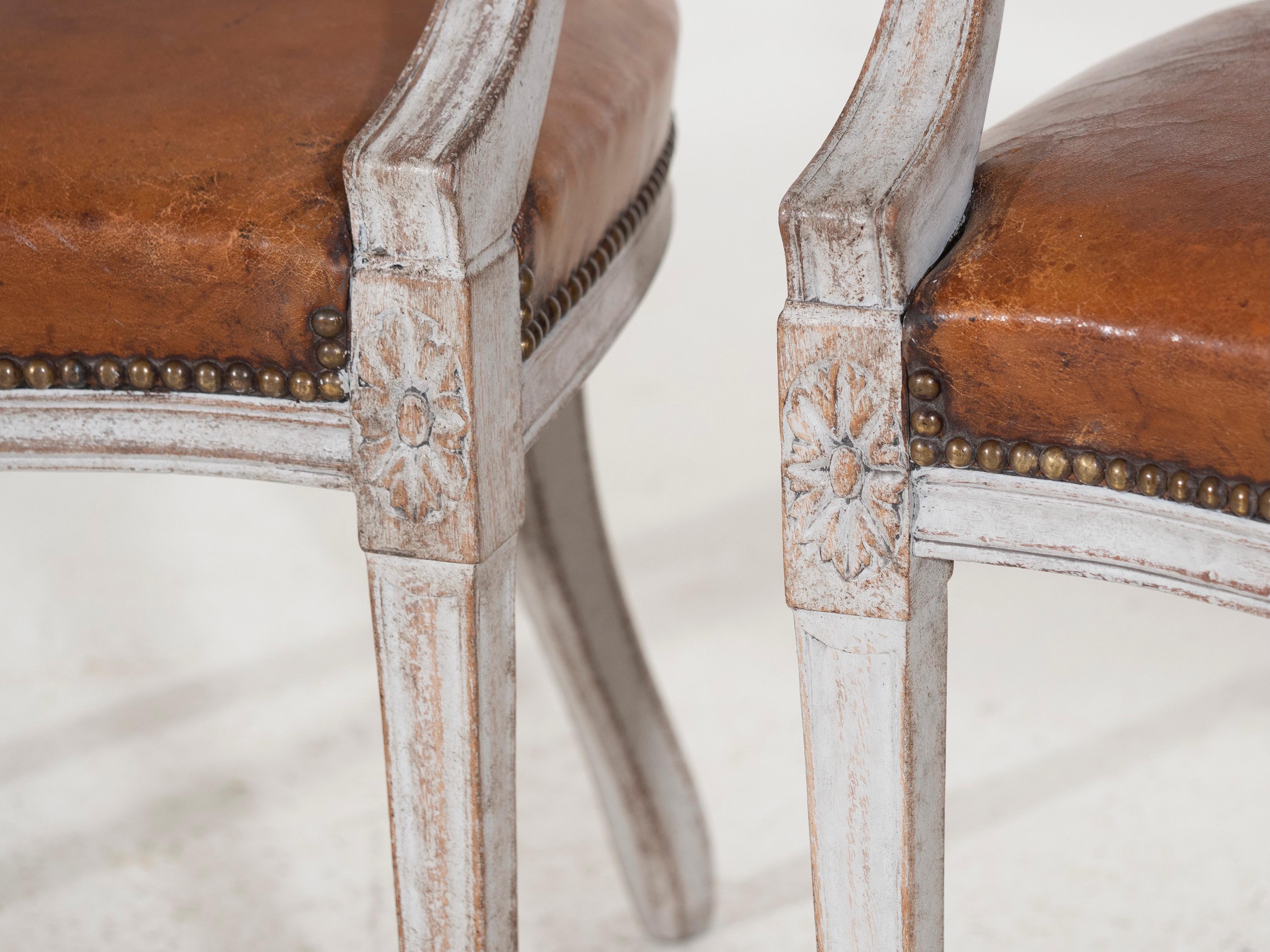Fine pair of European armchairs, richly carved with beautiful back and original leather seats, 19th Century.