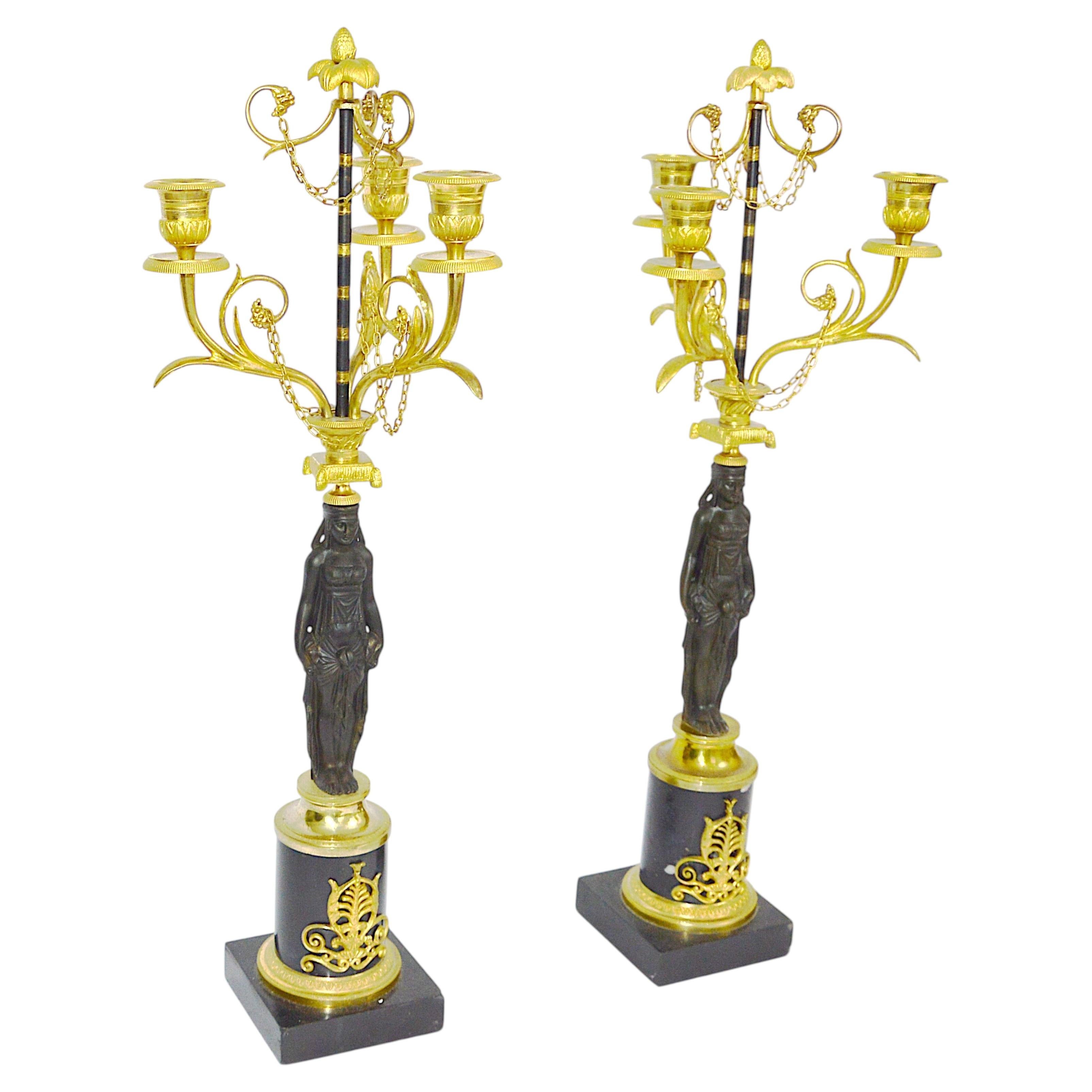 Fine pair of French bronze and gilded bronze candelabra from the 18/19 th For Sale