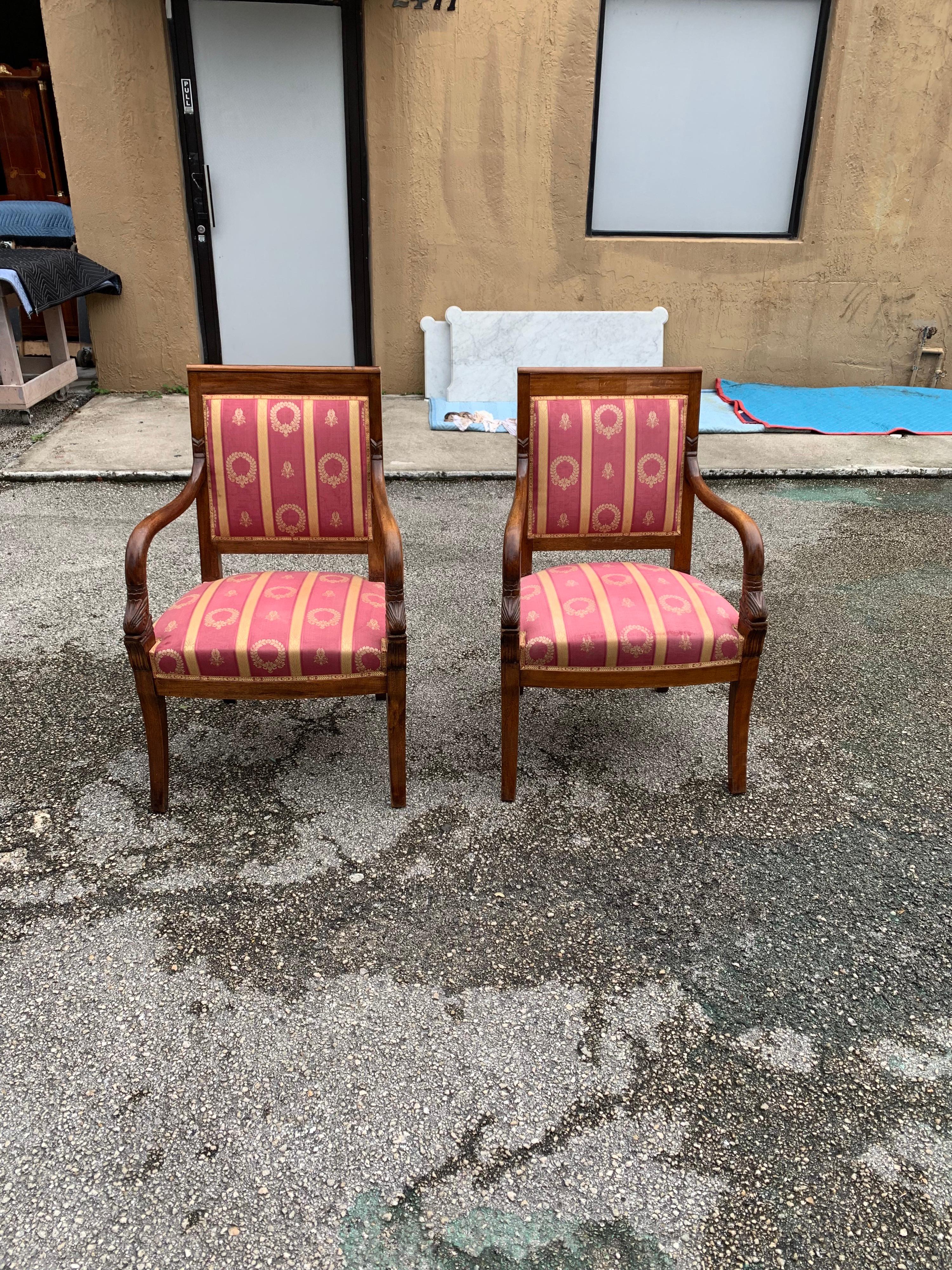 Fine pair of French Empire style solid mahogany accent chairs or bergère chairs 1910s, vintage silk fabric upholstery, the solid mahogany chair frames are in excellent condition. (Fabric silk is in very good condition, but the silk need to be change