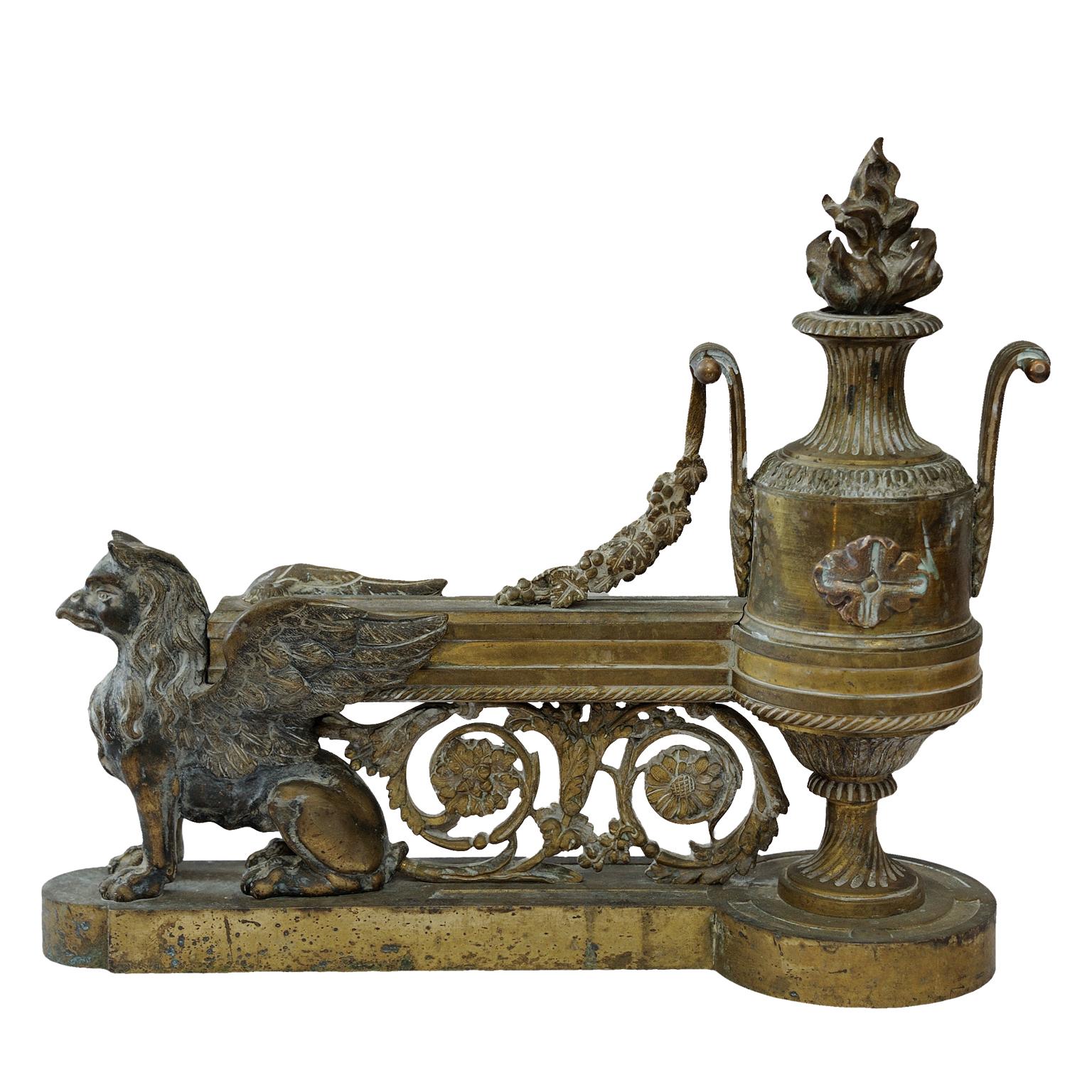 These are a mattractive pair of late 18th century French Louis XVI gilt brass fire dogs, decorated with griffins and flambeaux, circa 1795.
   