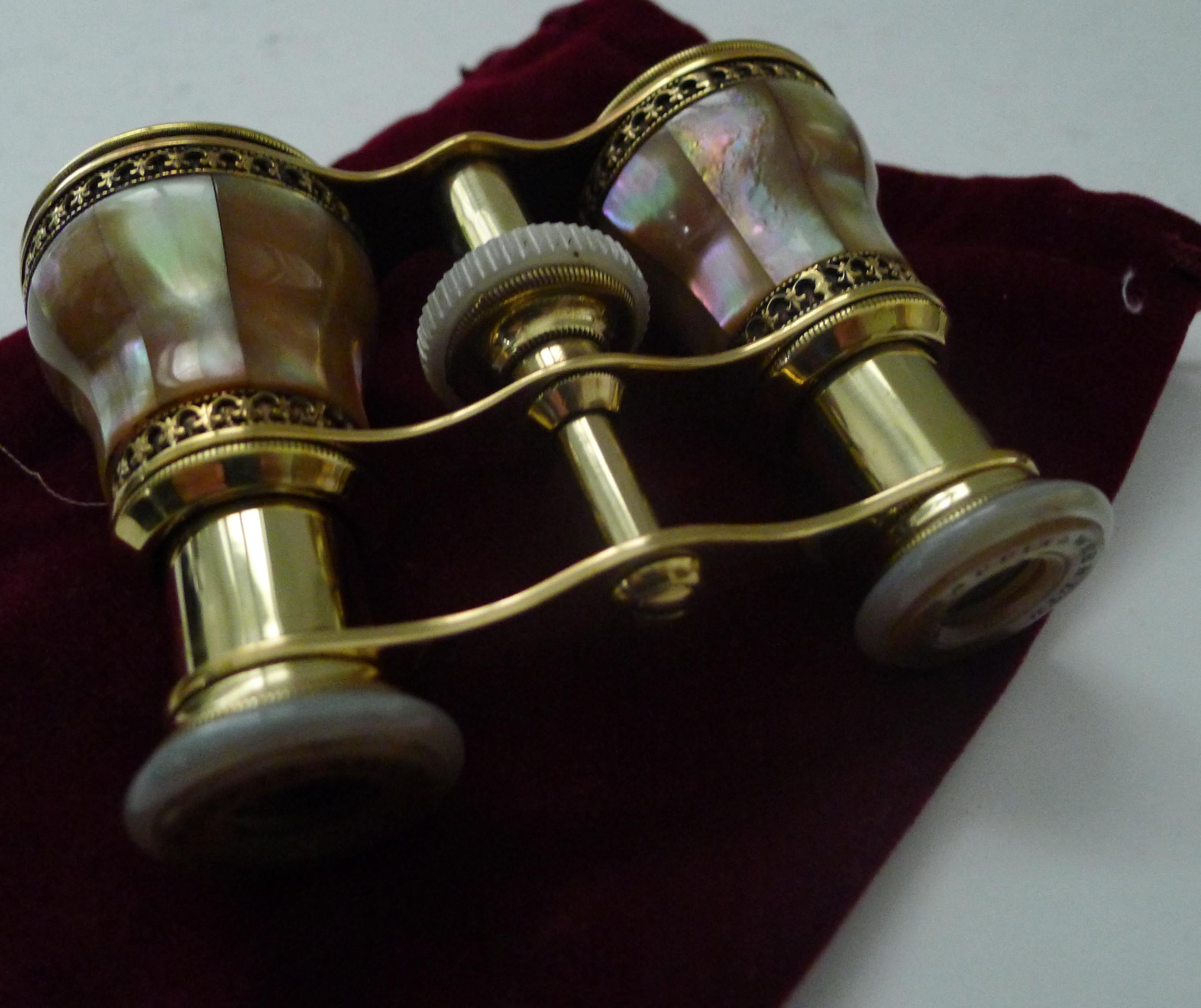 A very fine pair of Opera glasses, made from polished brass having been meticulously professionally polished, restoring them to their former glory. Covered in Mother of Pearl or Nacre shell with it's magical iridescent qualities, this pair is lucky