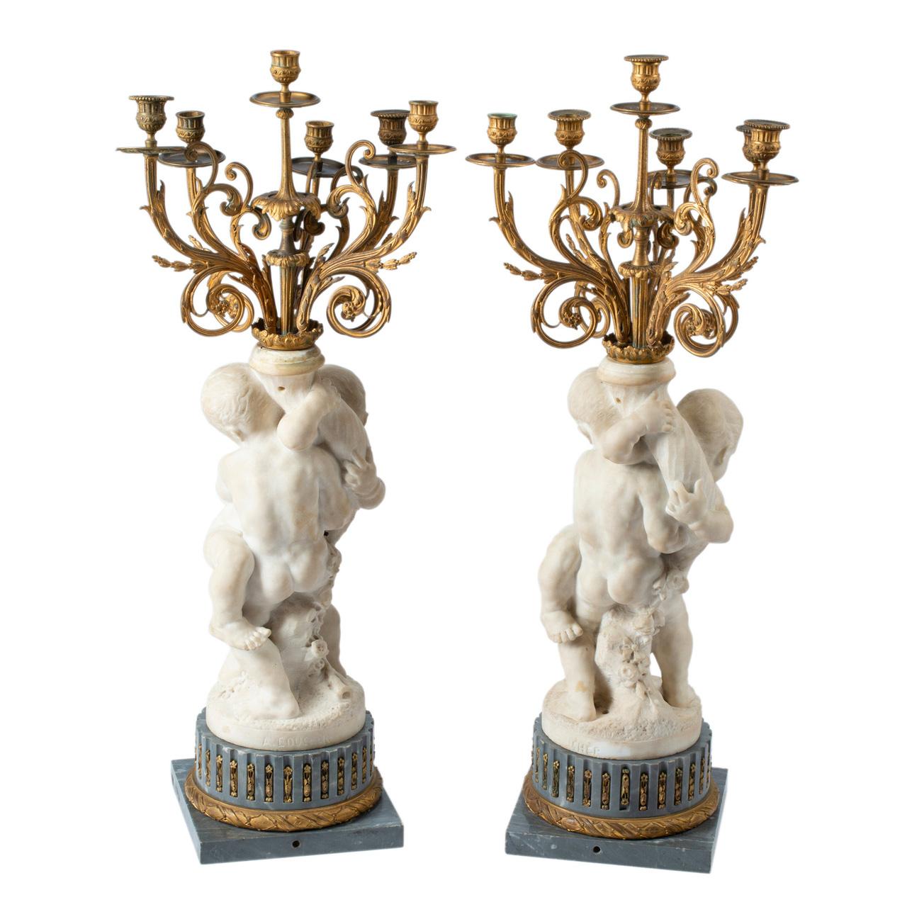A Fine Quality Pair of French White Marble with fine casting and Gilt Bronze Figural Six-Light Candelabras on Marble Bases signed 'A. BOUCHER'. 

Maker: Alfred Boucher (1850-1934)
Origin: French
Date: 19th century
Dimension: 35 1/2 in. x 14 in.