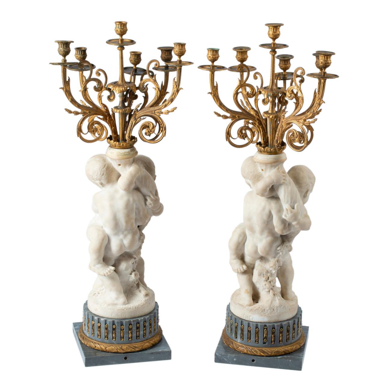 Paire de candélabres à six lumières en marbre blanc et bronze doré sur base en marbre, signés 'A. BOUCHER'. 

Créateur : Alfred Boucher (1850-1934)
Origine : Français
Date : 19ème siècle
Dimension : 35 1/2 in. x 14 in. x 12 in.