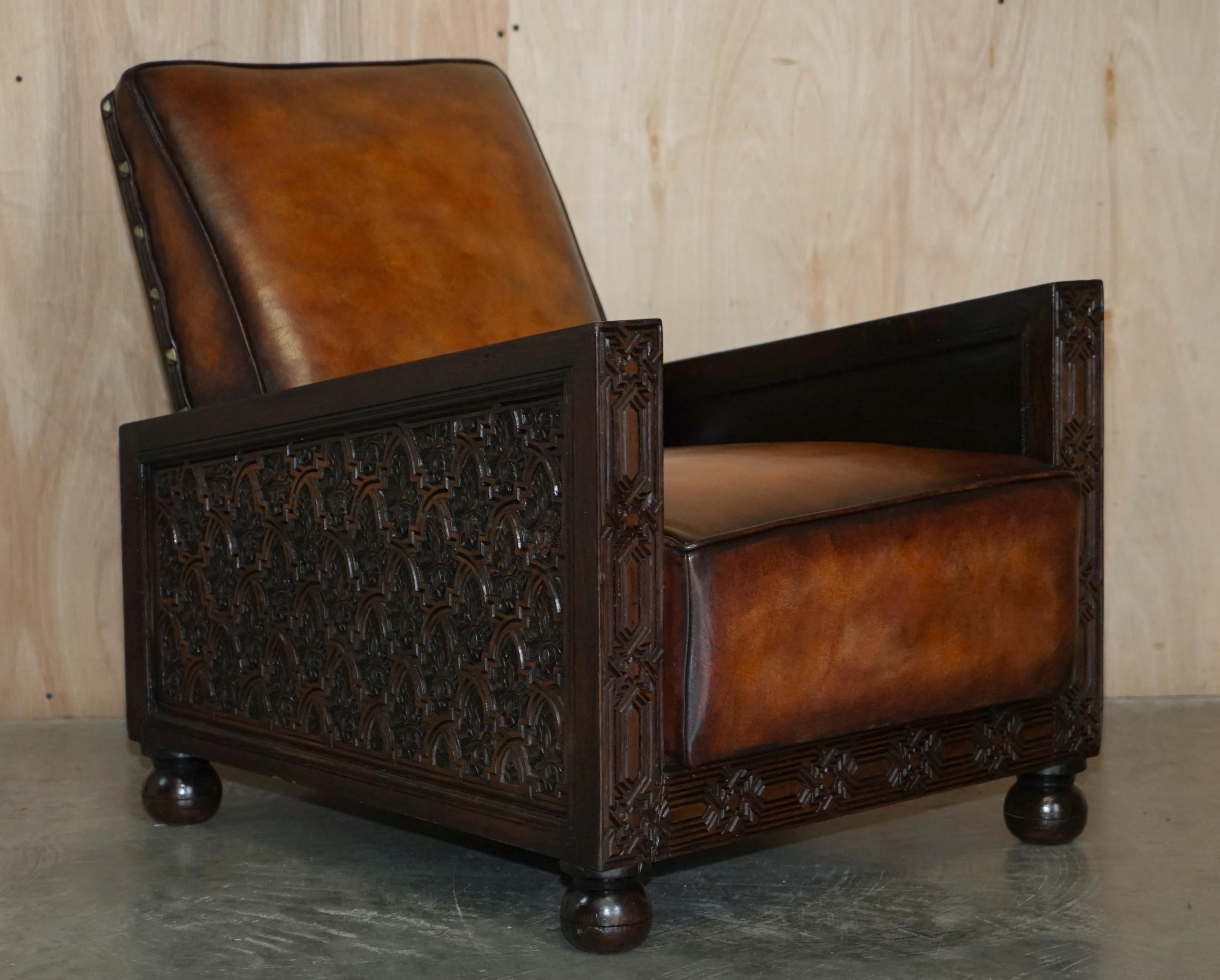We are delighted to offer for sale this stunning fully restored pair of antique hand dyed Cigar brown leather Art Deco club armchairs with hand carved panels.

An exceptionally good looking well-made and comfortable pair of armchairs, these are