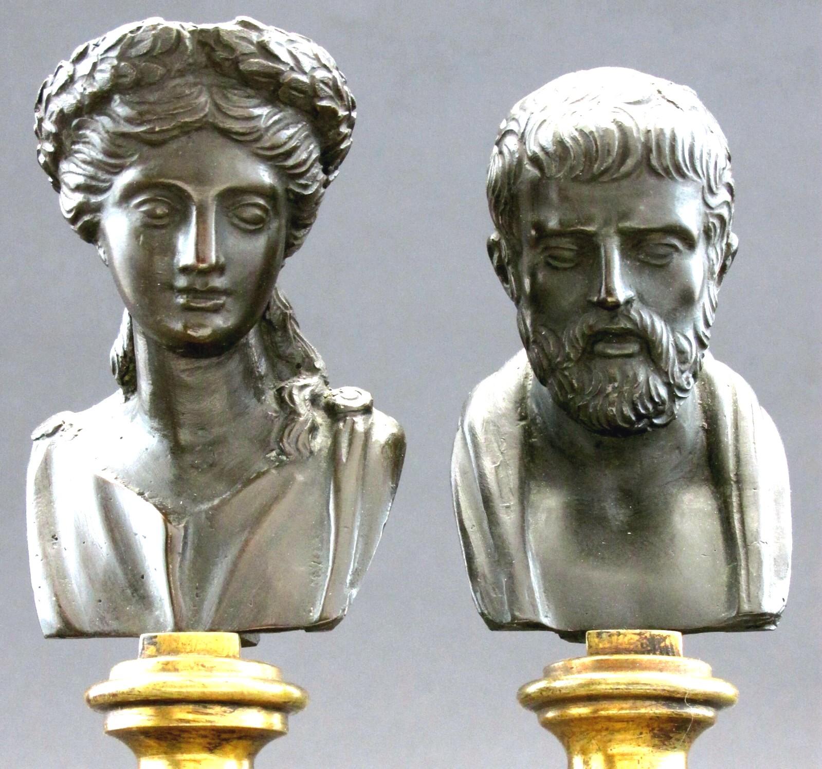 A very handsome pair of classical bronze busts raised on white alabaster columns decorated with gilt metal rings, atop squared rouge royal marble bases decorated with gilt metal wrythen hoops. 
Apparently unmarked but most likely produced at the