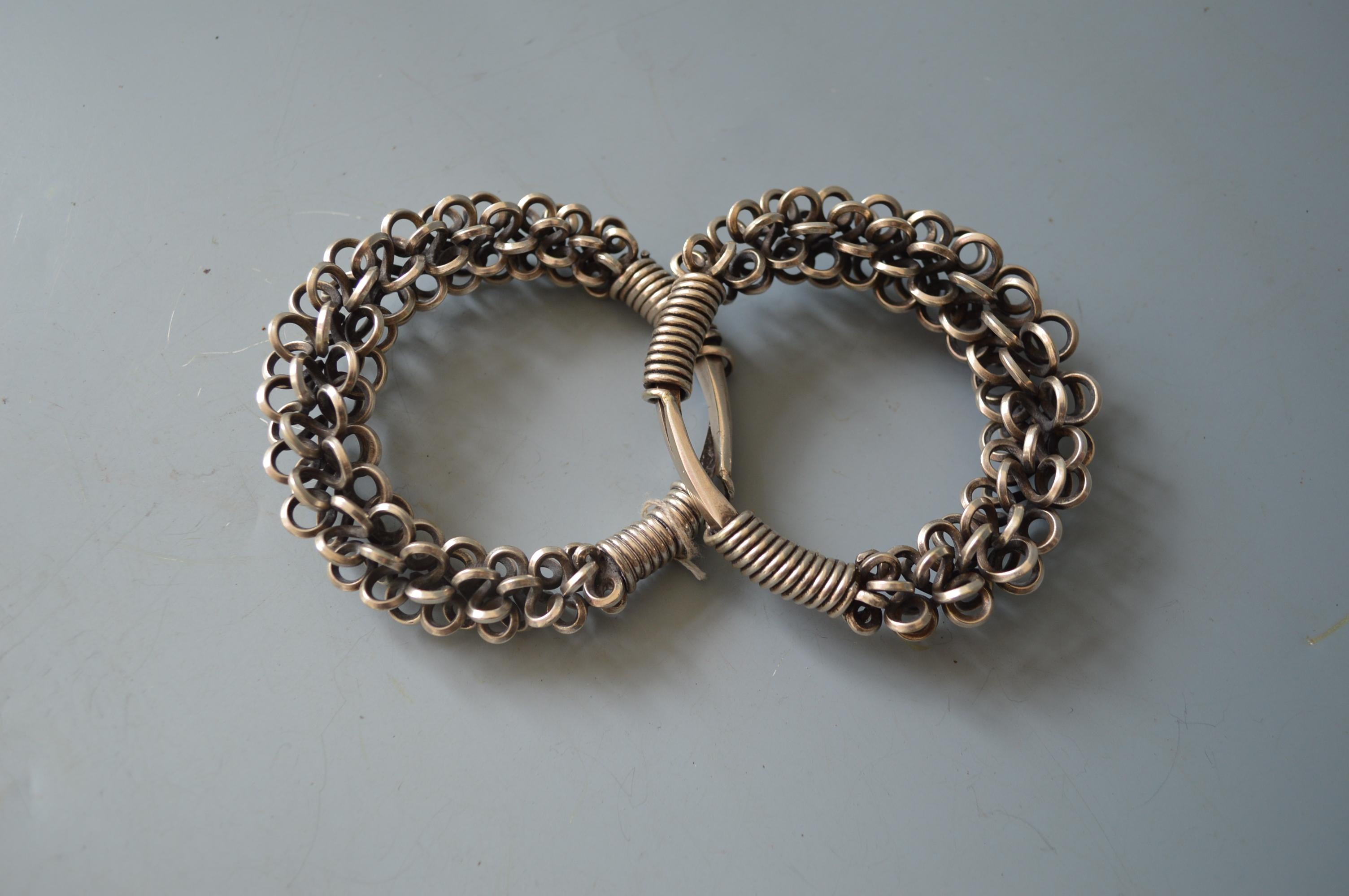 A fine pair of Hmong or Miao silver bracelets from the Golden Triangle region of south east Asia: Laos Thailand Yunnan China South East Asia
A substantial pair of Tribal bracelets crafted from wound hammered high grade silver, they have a