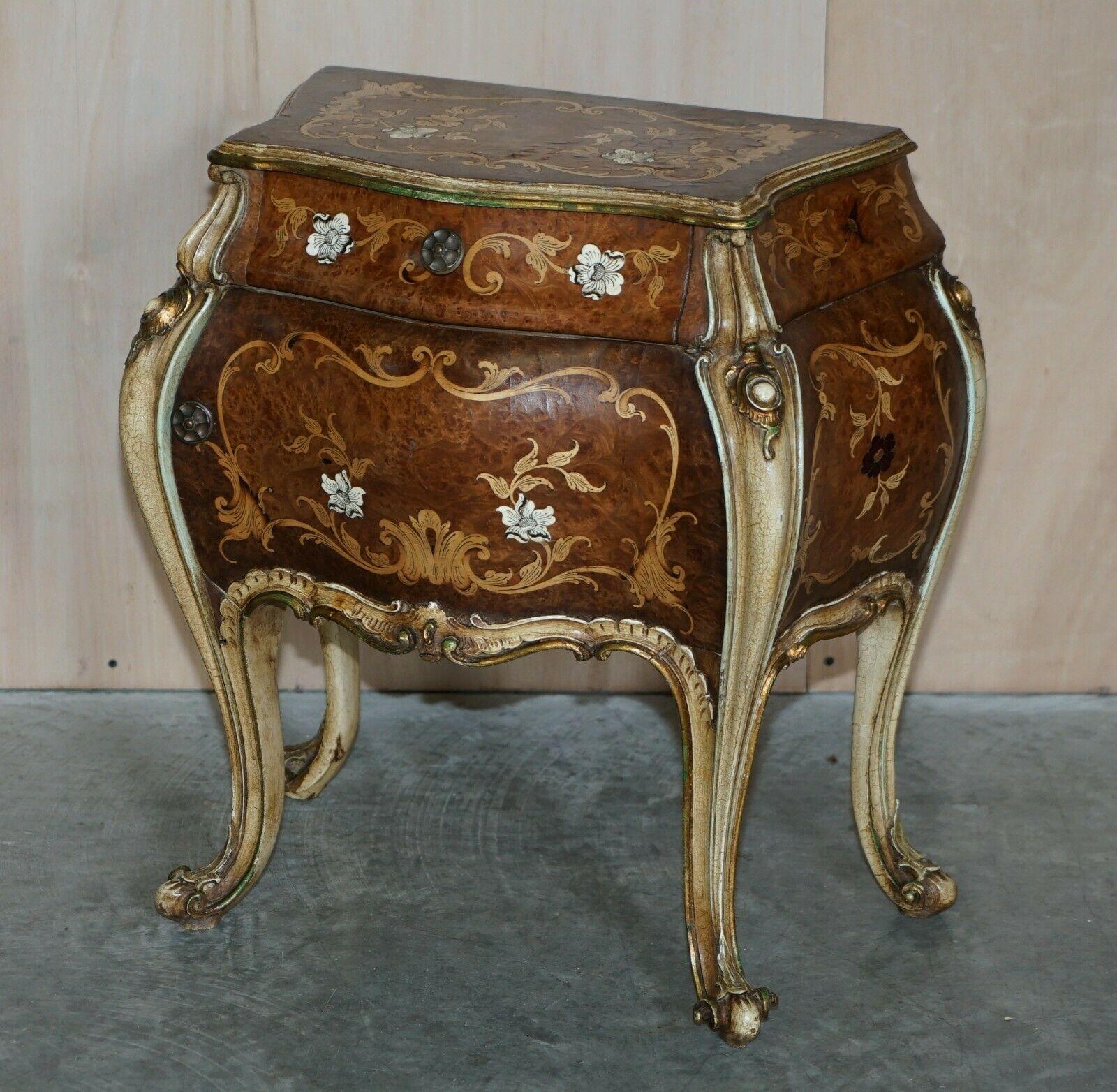 We are delighted to offer this very decorative pair of Burr Walnut, Italian Marquetry inlaid Bombe bedside table sized chests

A very good looking and well made pair of vintage bombe chests. The timber patina is exquisite, highly burred with a