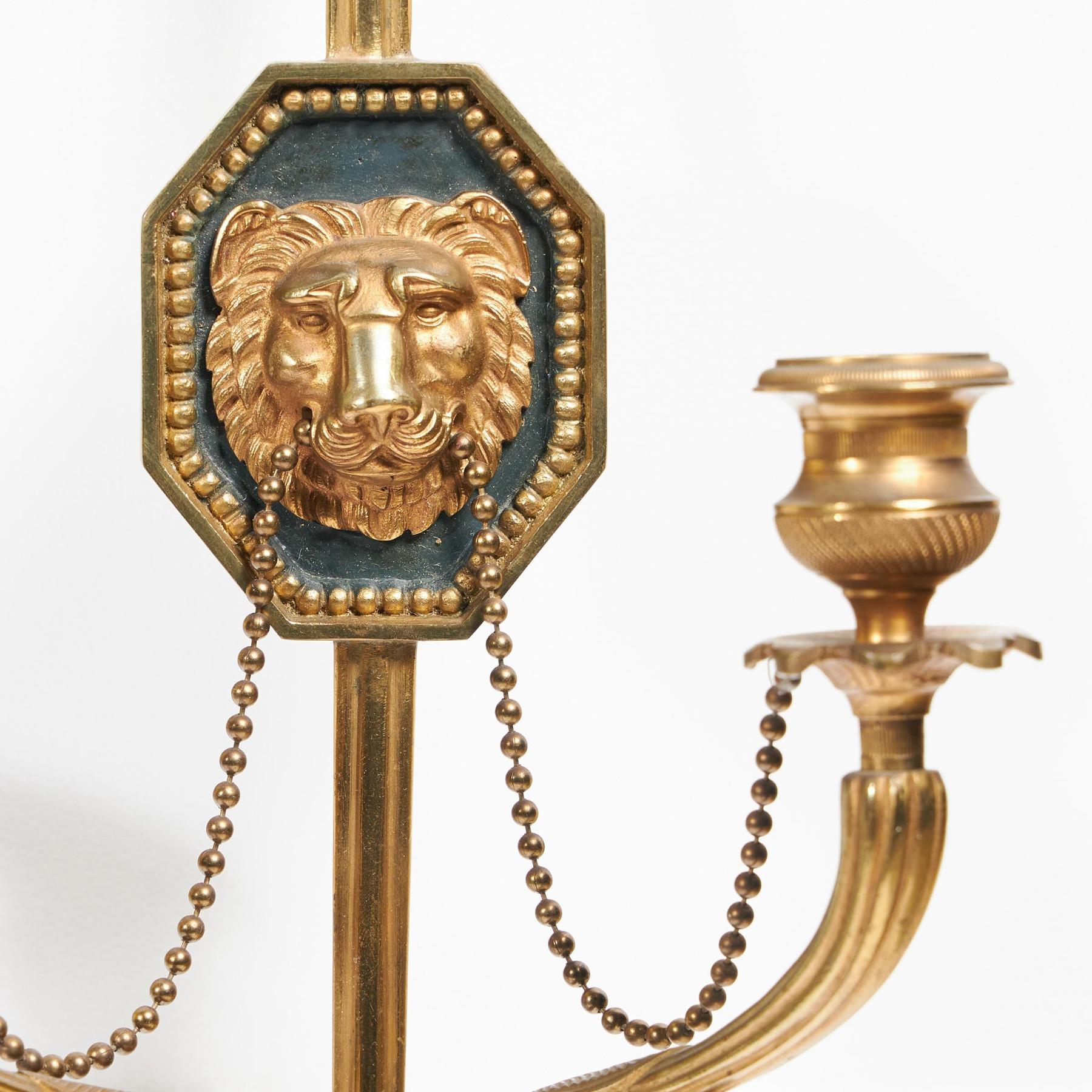 Fine Pair of Italian Ormolu Wall Lights or Appliques in the French Empire Style, two pairs are available.



Italian - Circa 1880



These lovely wall lights are conceived as notched arrows with lion mask plaques in the centre of the shafts. The