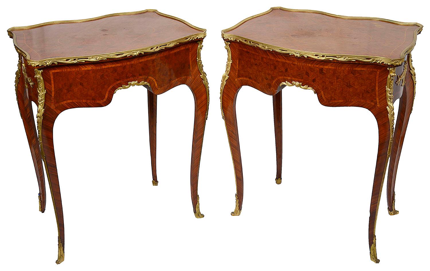 A fine quality pair of late 19th century French parquetry inlaid side tables, each with wonderful parquetry inlaid decoration, classical Rococo style gilded ormolu mounts, five drawers with shell like handles, free standing and raised on elegant
