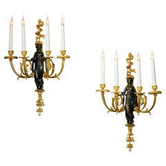 Raffinata coppia di appliques da parete in bronzo dorato e patinato in stile Luigi XVI