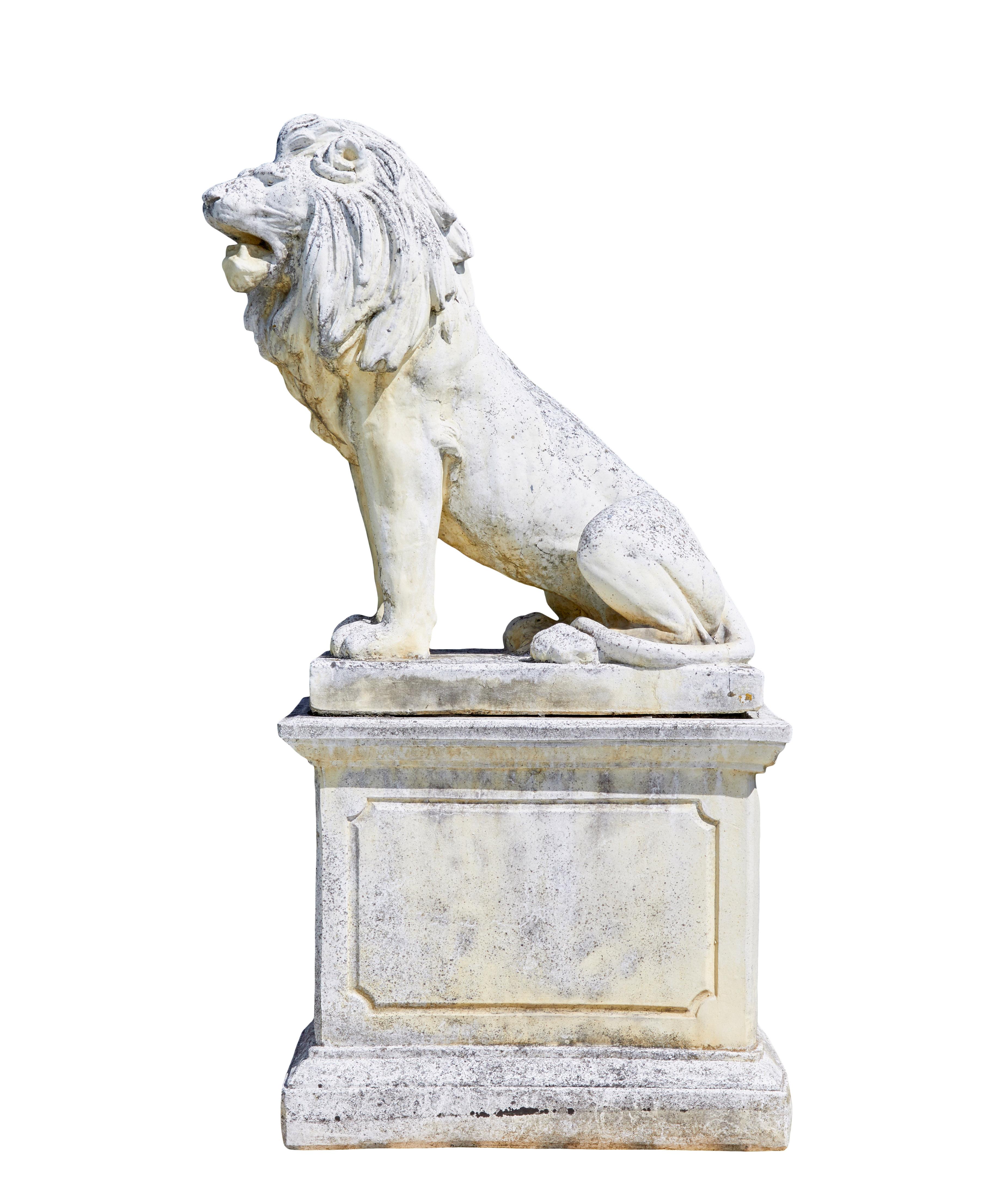 Hand-Carved Fine pair of mid century carved stone lion statues For Sale