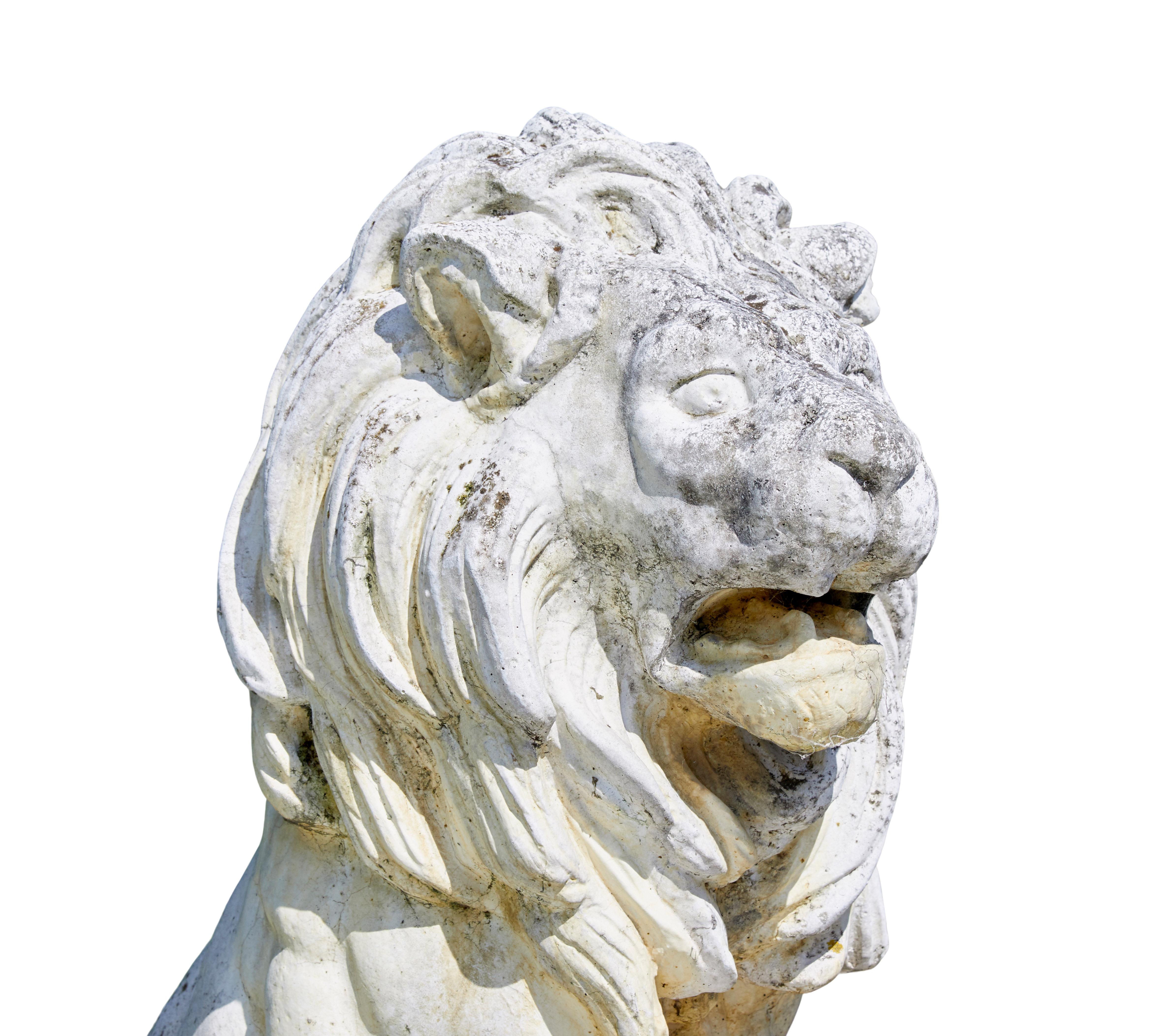 Stone Fine pair of mid century carved stone lion statues For Sale