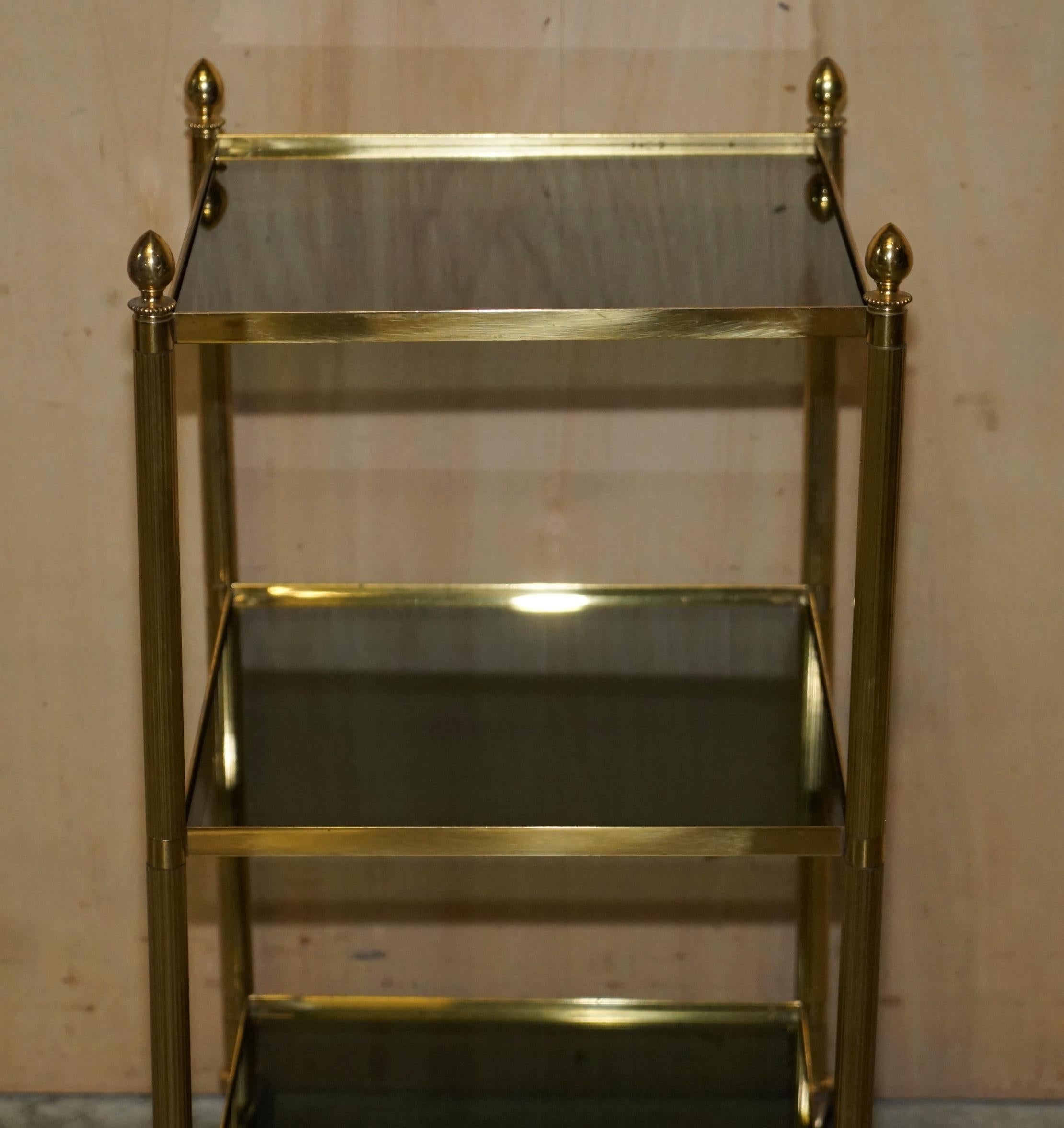 Hand-Crafted Fine Pair of Mid-Century Modern Brass and Smoked Glass Three Tier Etagere Tables For Sale