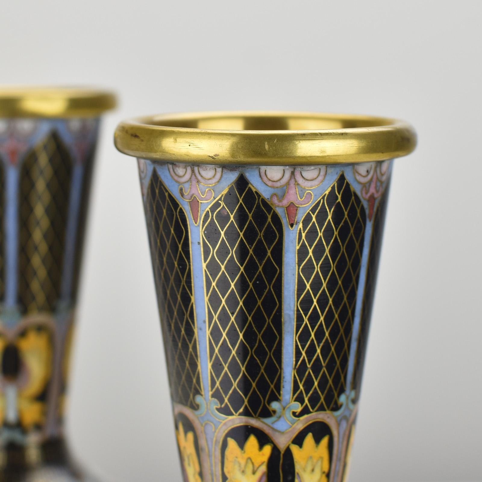 The fine pair of mirrored gilt cloisonné enamel butterfly vases from the mid 20th-century are exquisite examples of Chinese artistry and craftsmanship. These vases combine several intricate and delicate techniques, resulting in stunning decorative