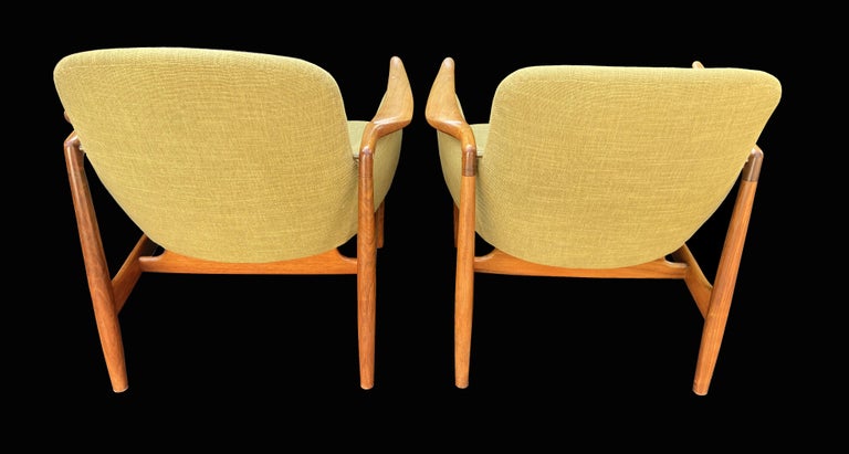 These are a very fine pair of NV53 chairs designed by a master of chair design, Finn Juhl and made by a master cabinet maker, Niels Vodder.The beautiful shaped arms are held in place by small brass supports.

We bought these from their original