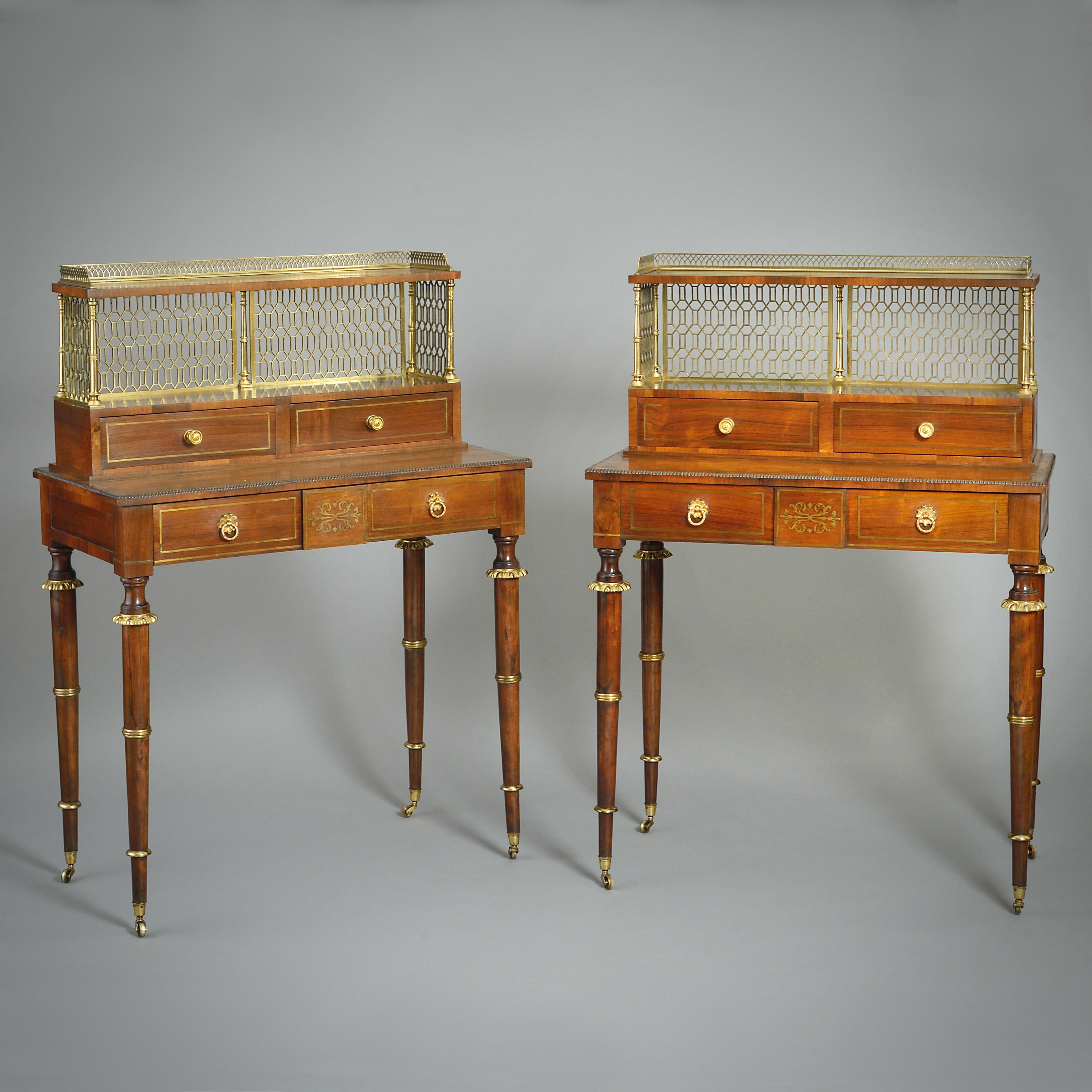 A FINE PAIR OF REGENCY ORMOLU-MOUNTED AND BRASS-INLAID ROSEWOOD BONHEUR-DU-JOURS ATTRIBUTED TO JOHN MCLEAN, CIRCA 1810.

Each with a galleried super structure fitted with two drawers above a long frieze drawer on turned legs with ormolu-collars.