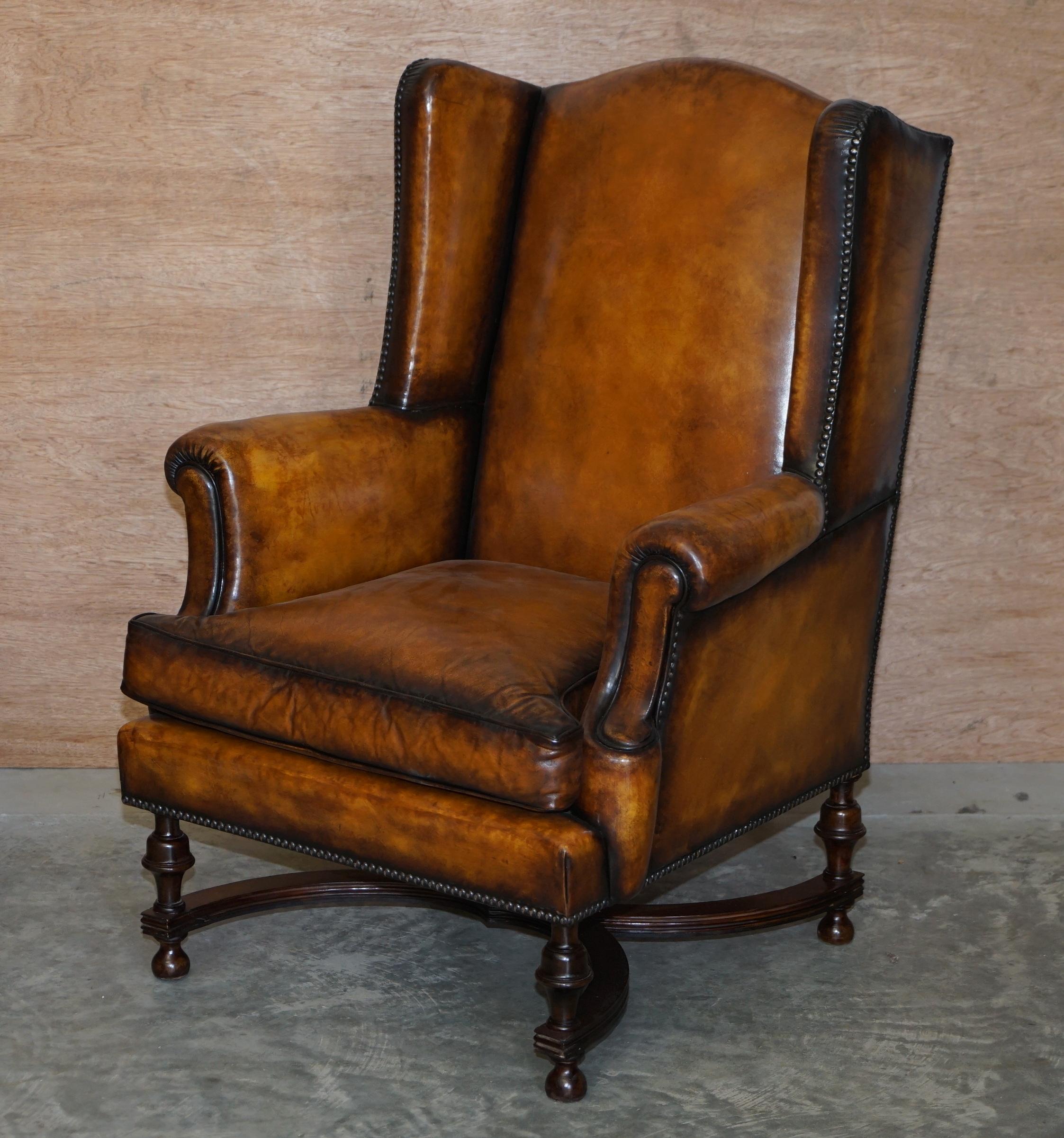 We are delighted to offer for sale this very fine pair of fully restored high Victorian circa 1880 hand dyed whiskey brown leather William & Mary style wingback armchairs

These chairs are very fine examples, they have ornate William & Mary style
