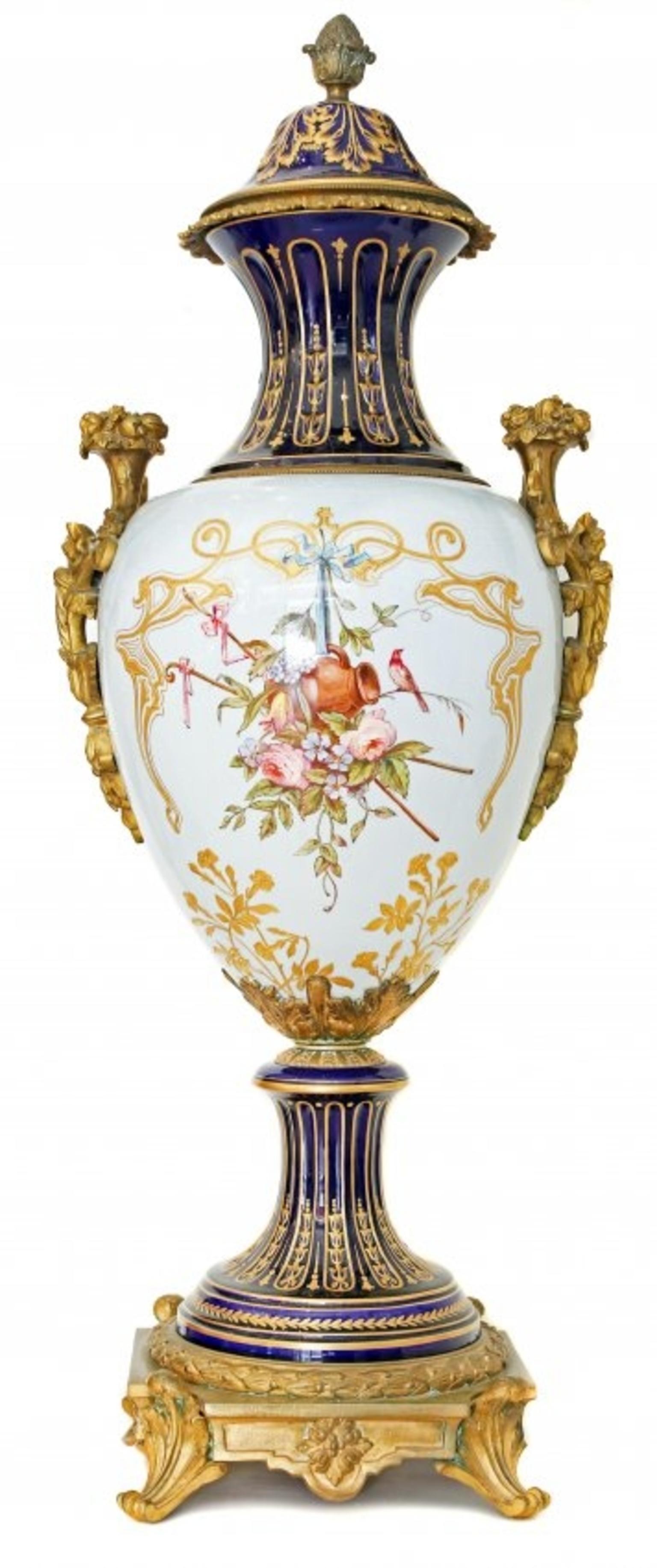 Fine pair of 'Sèvres' gilt bronze-mounted painted and parcel gilt porcelain covered vases
late 19th century, Paris, the painting by Poitevin,
the baluster sky blue and cobalt ground vessels painted in the Art Nouveau taste; with fluted necks above