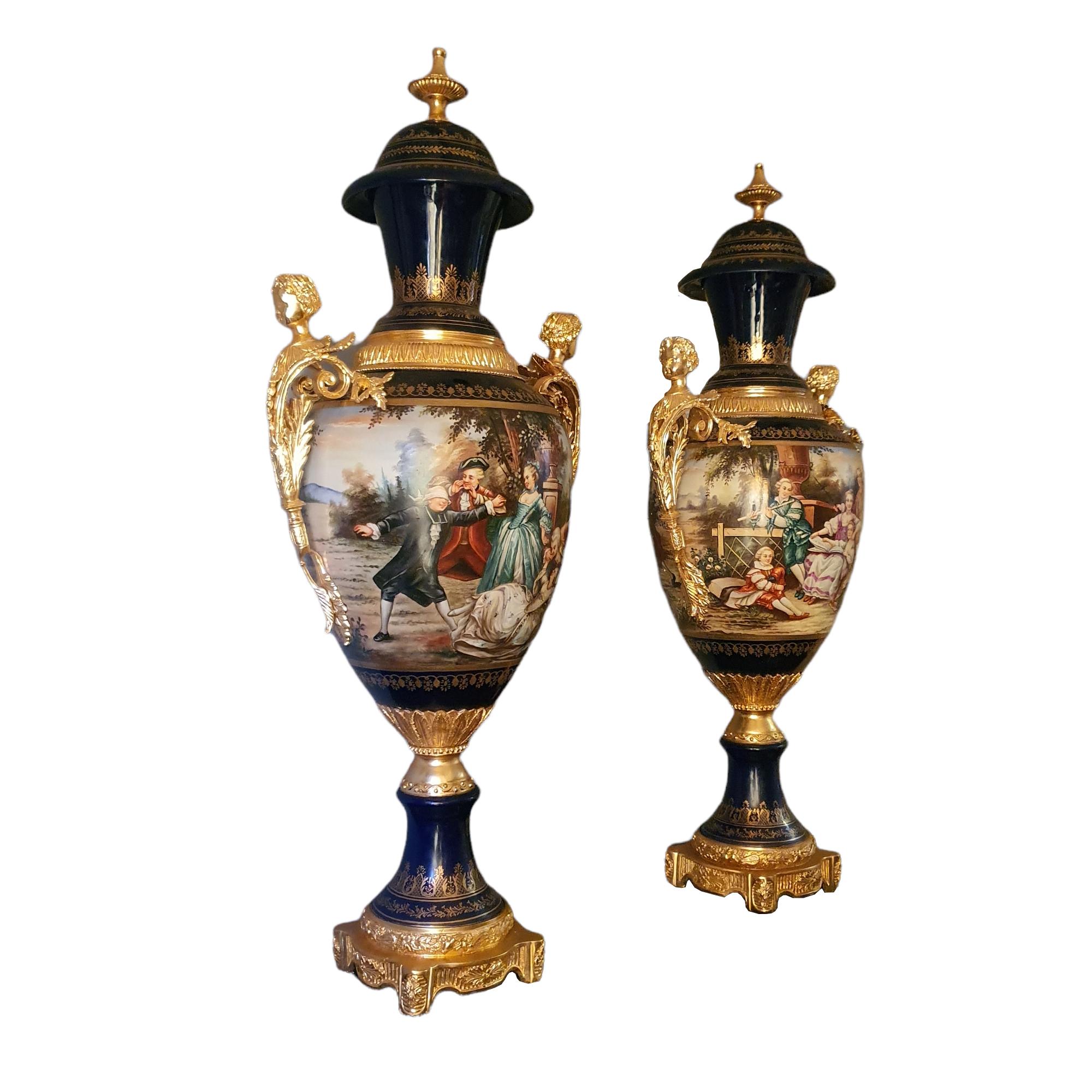 Beautiful pair of Napoleonic Sèvres vases in cobalt blue ground porcelain mounted in gilt bronze, embellished with gilt bronze handles and applications with pure gold.
Both rest on a gilt bronze base.
French, circa 1900.